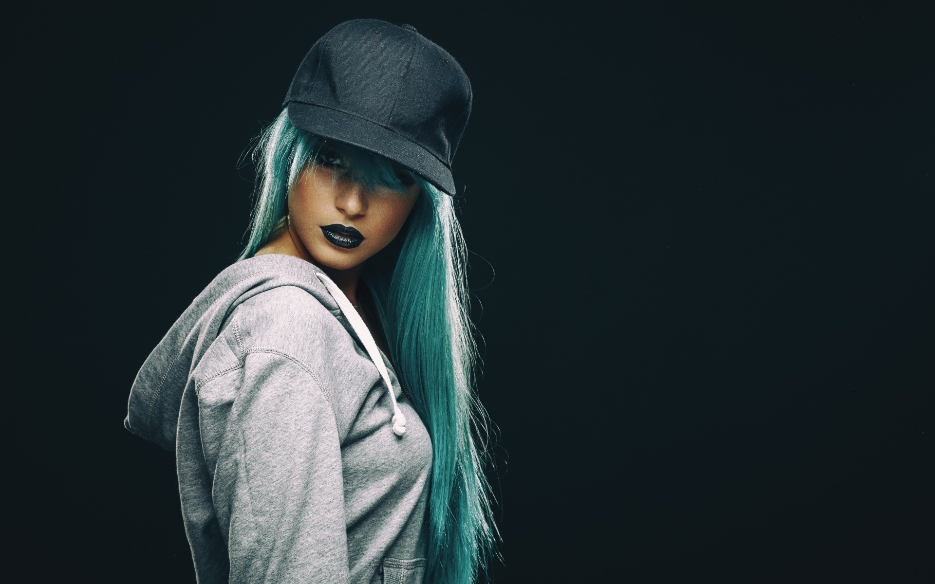 Woman with blue hair and black lipstick wearing a hat and hoodie HD Wallpaper