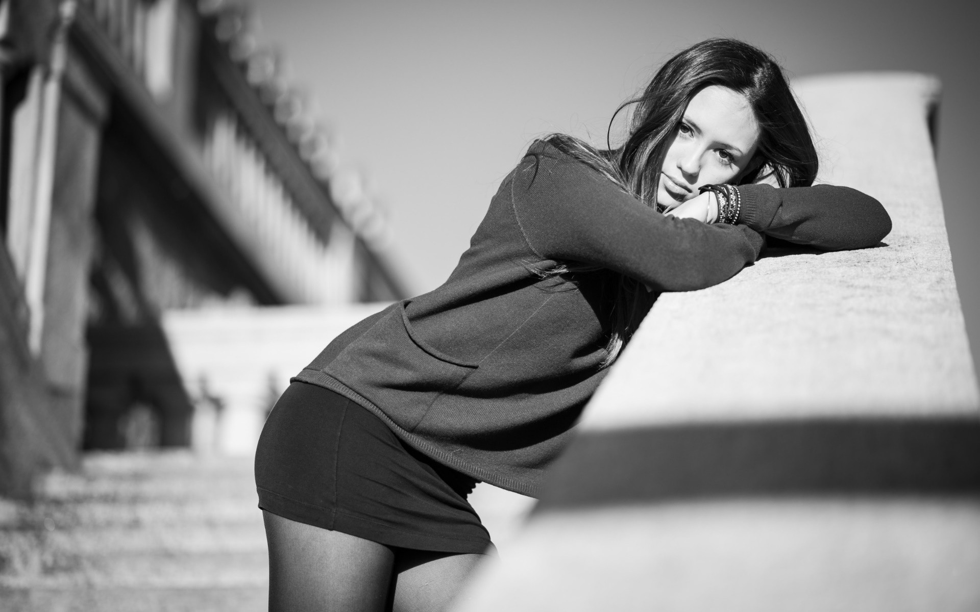 Woman leaning on a railing outdoors HD Wallpaper