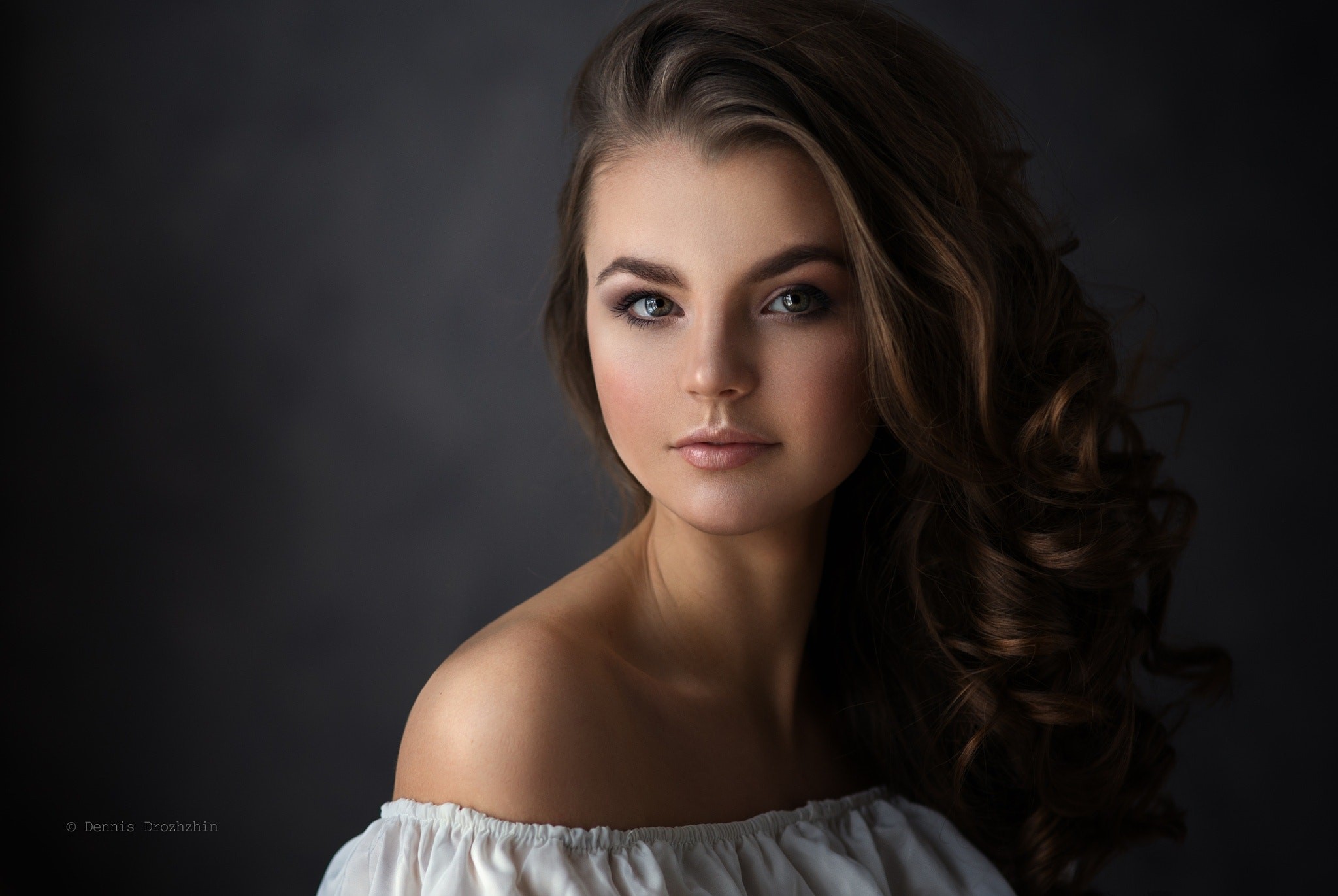 Portrait of a young woman with curly brown hair HD Wallpaper