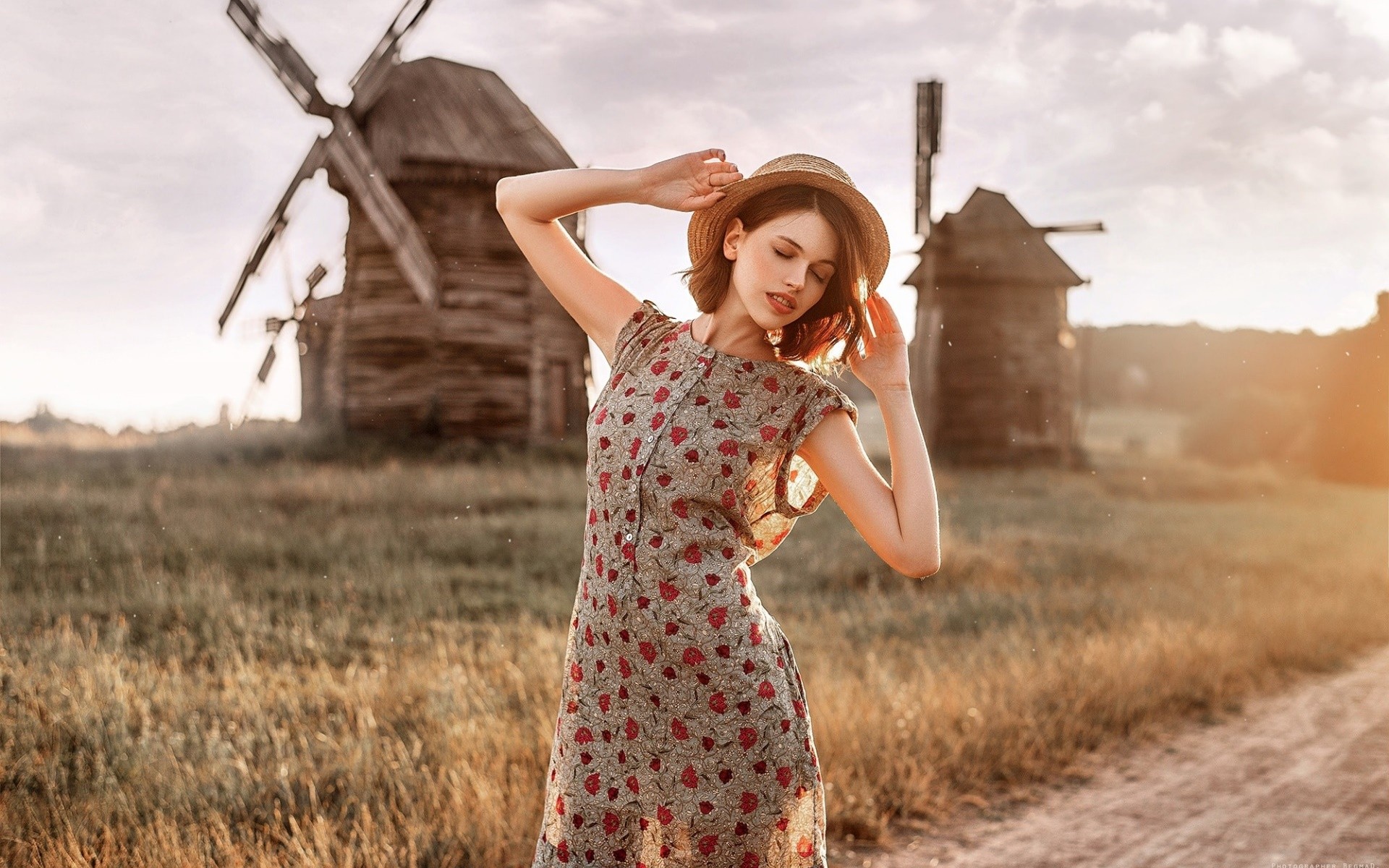 Woman in a dress and hat near windmills HD Wallpaper