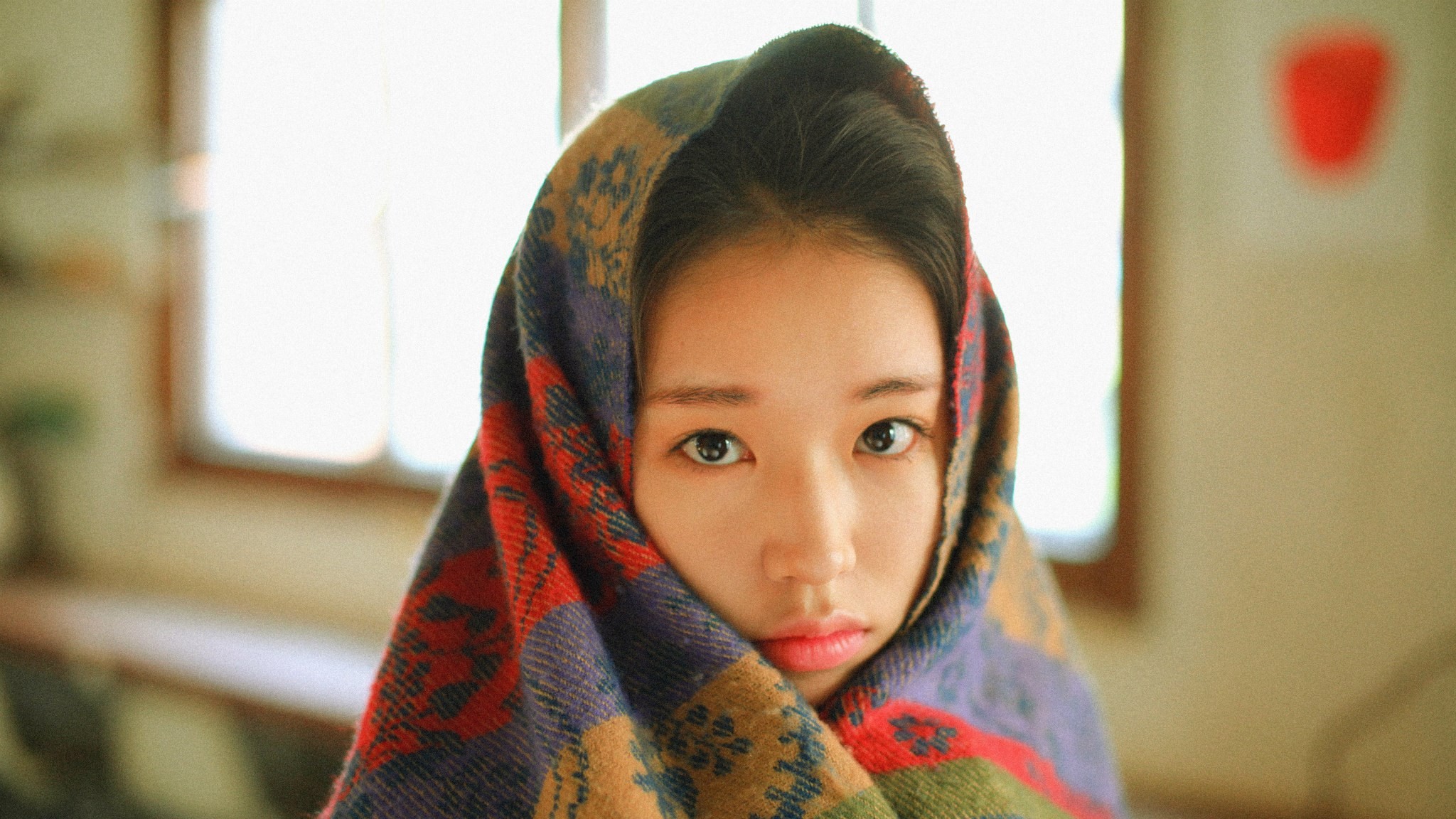 Woman wrapped in a colorful scarf HD Wallpaper