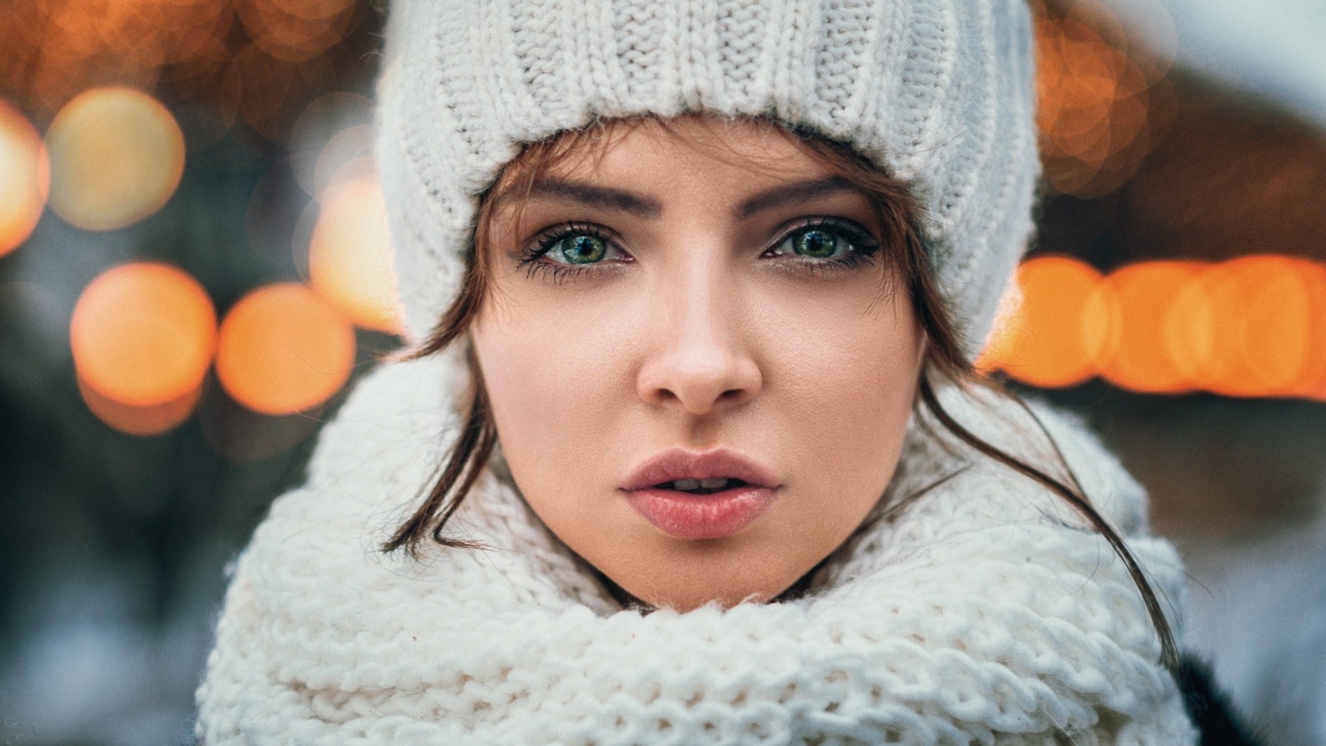 Woman in winter hat and scarf with bokeh lights HD Wallpaper