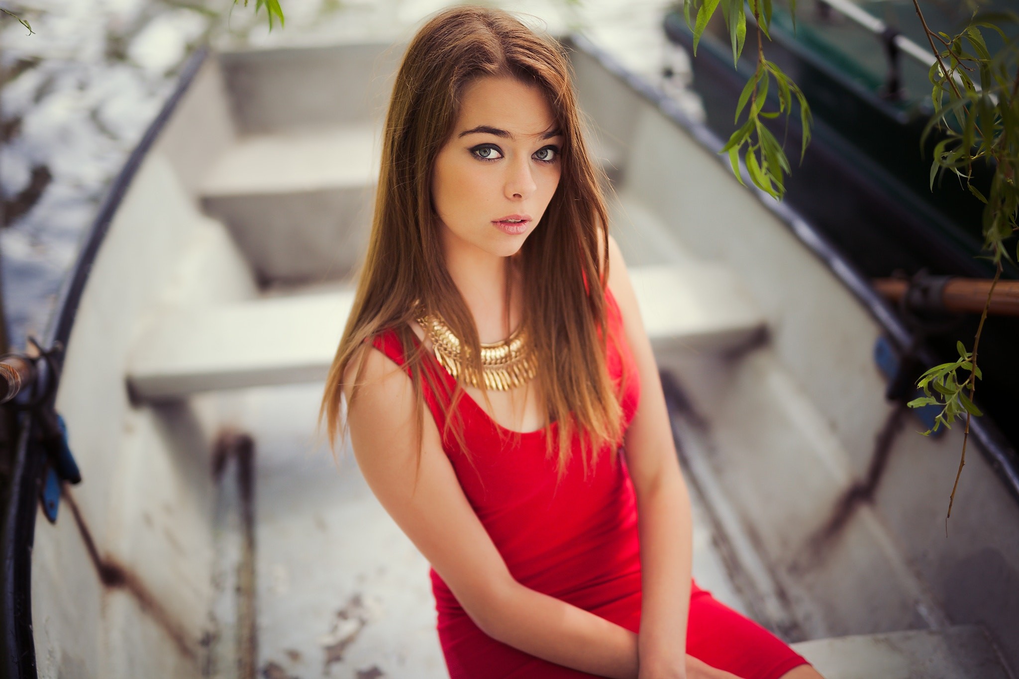 Woman in red dress sitting in a boat HD Wallpaper