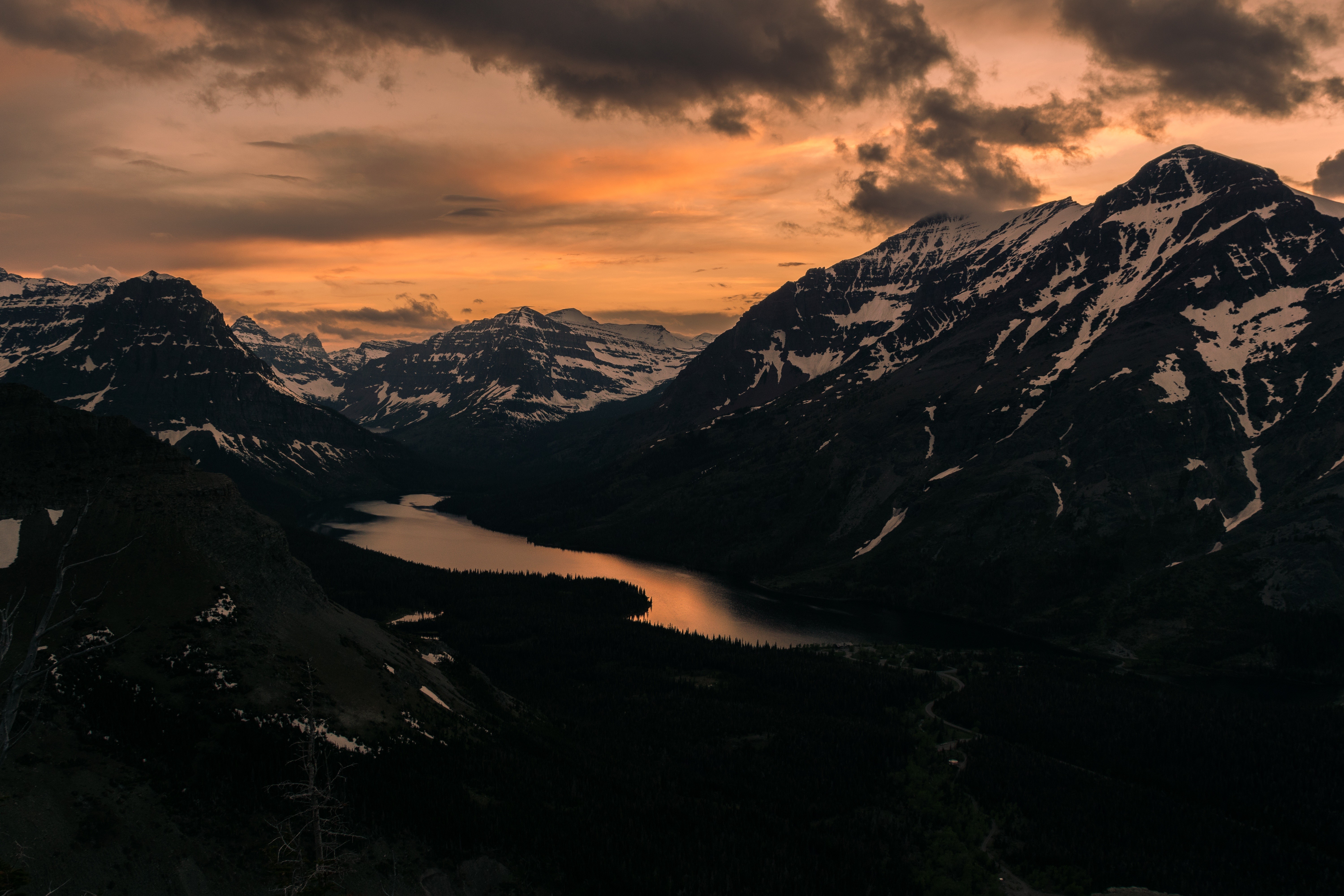 Snow-capped mountains and lake at sunset HD Wallpaper