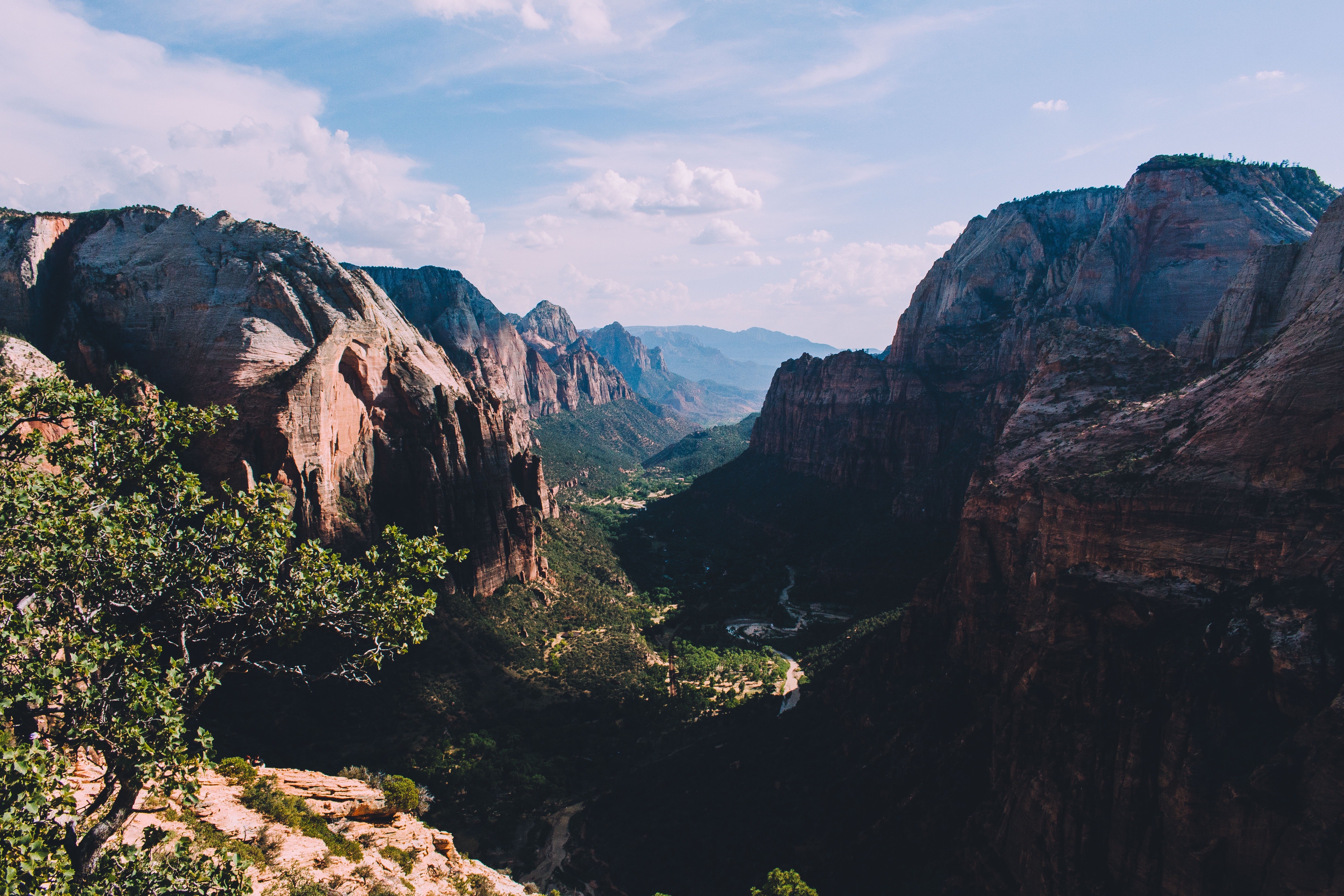 Majestic mountain valley with trees and clouds HD Wallpaper