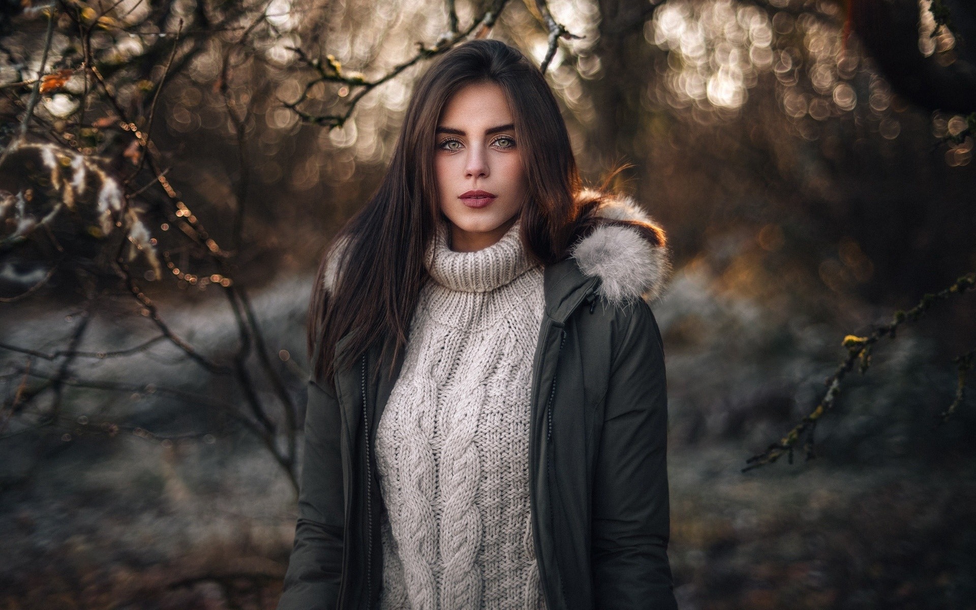 Woman wearing a sweater and parka outdoors in winter HD Wallpaper