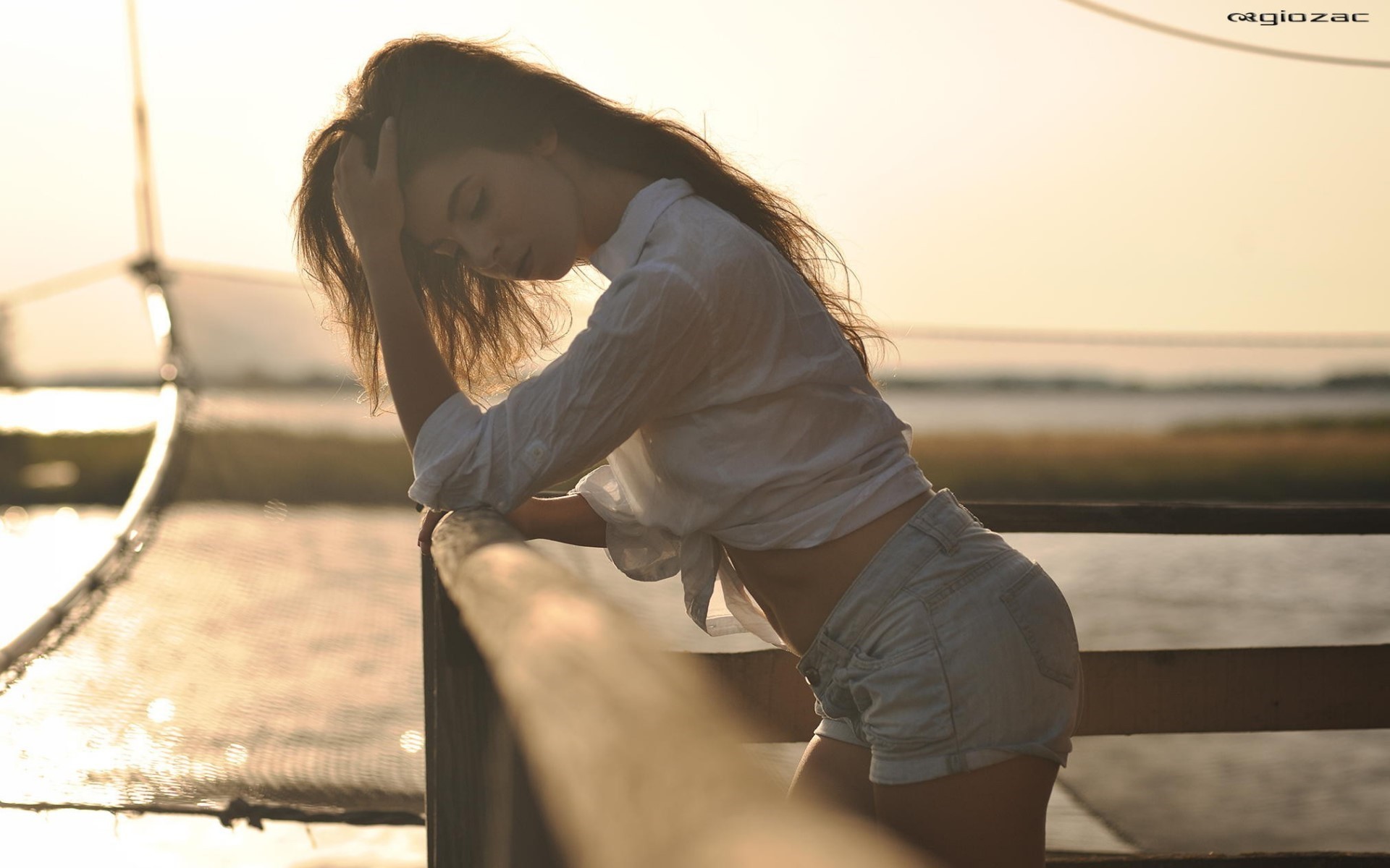 Woman in jean shorts and white shirt outdoors HD Wallpaper