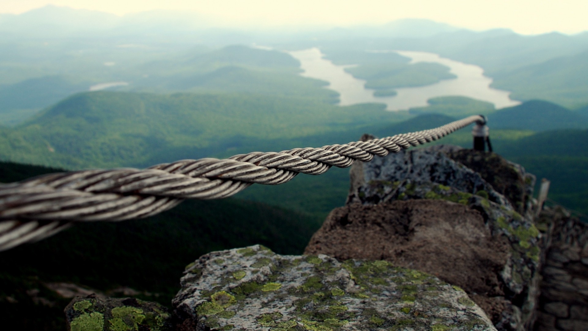 Cable railing on a mountain overlooking a lake HD Wallpaper