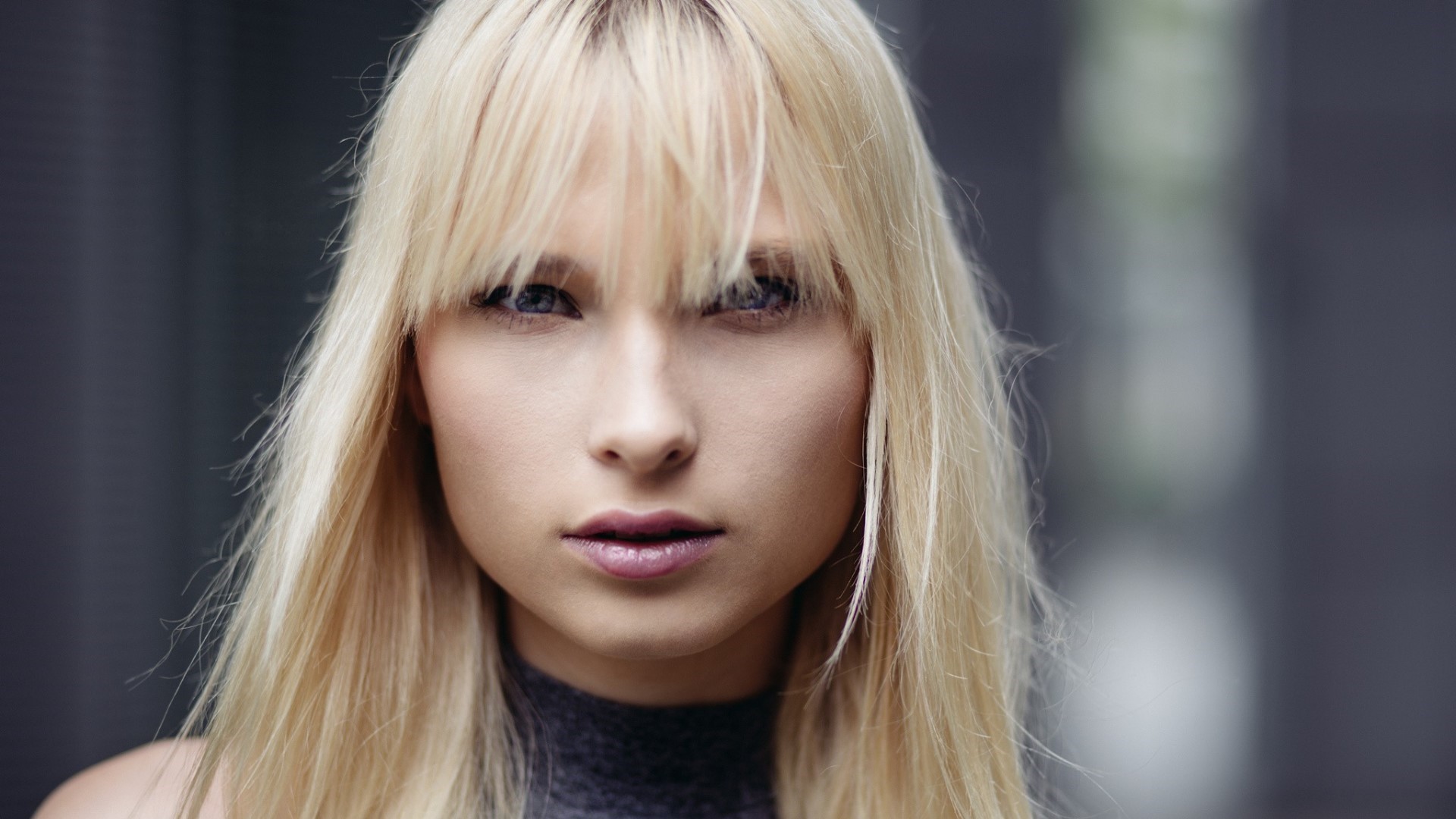 Portrait of a blonde woman with bangs HD Wallpaper