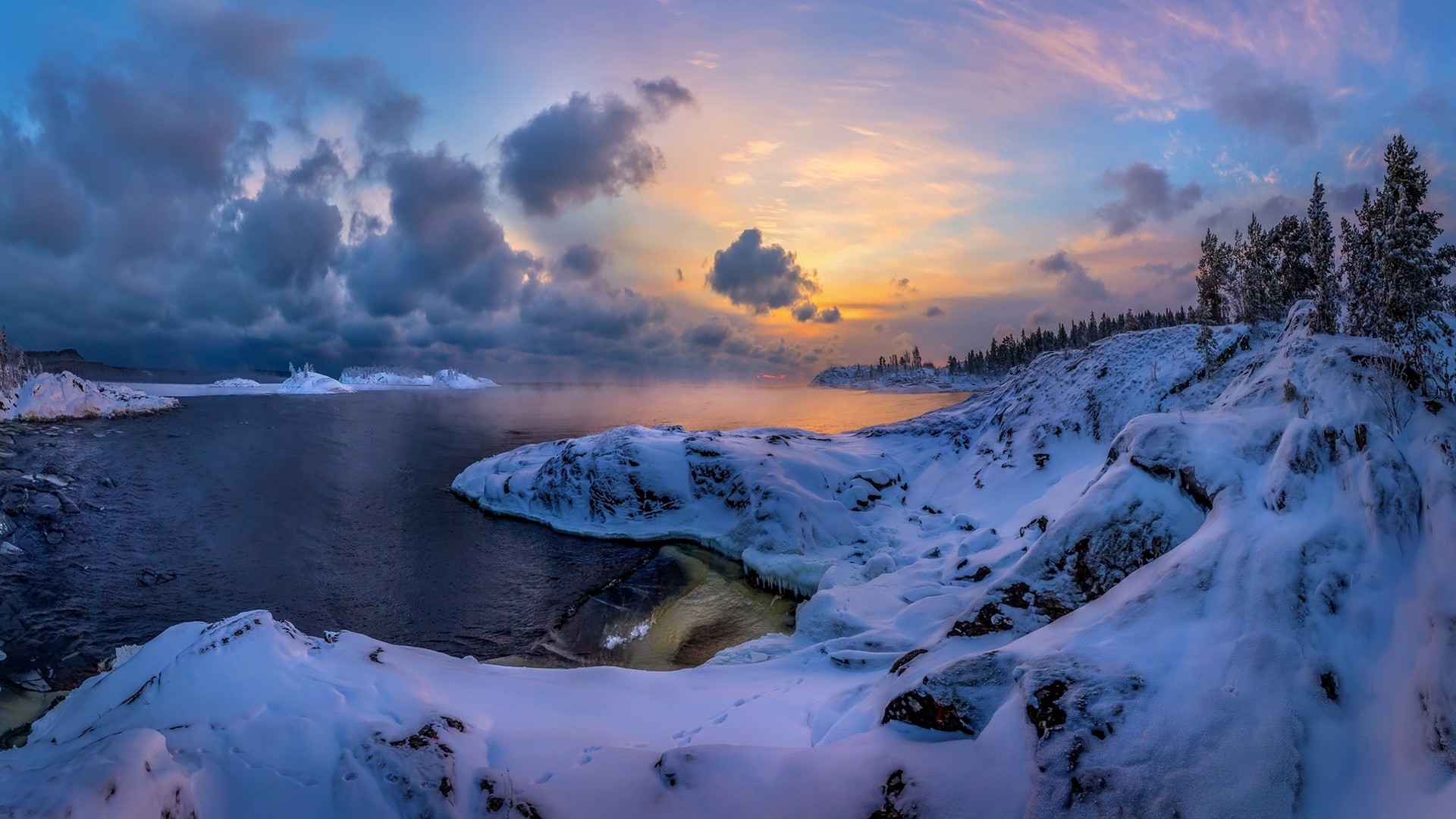 Snowy winter landscape with frozen lake and sunset sky HD Wallpaper