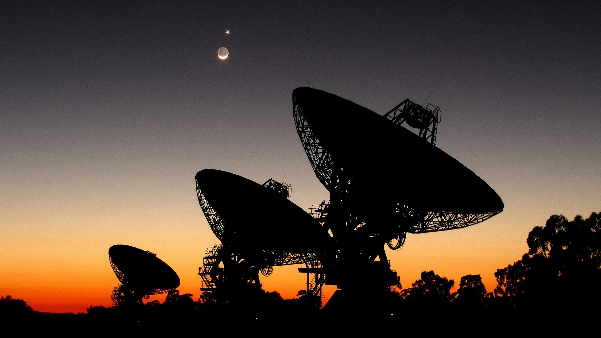 Radio telescopes at sunset with moon and planet HD Wallpaper