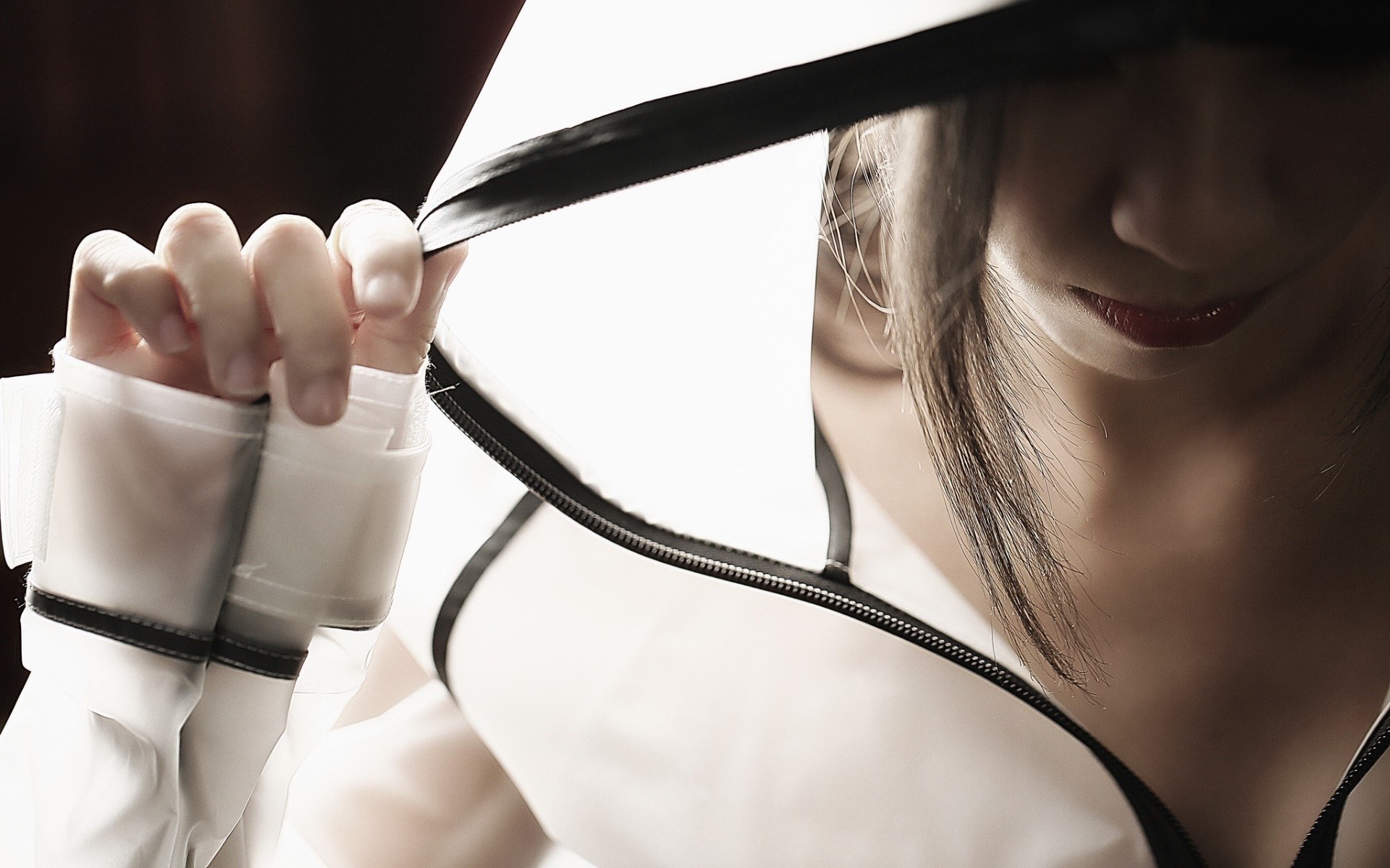 Asian woman zipping up a white jacket HD Wallpaper