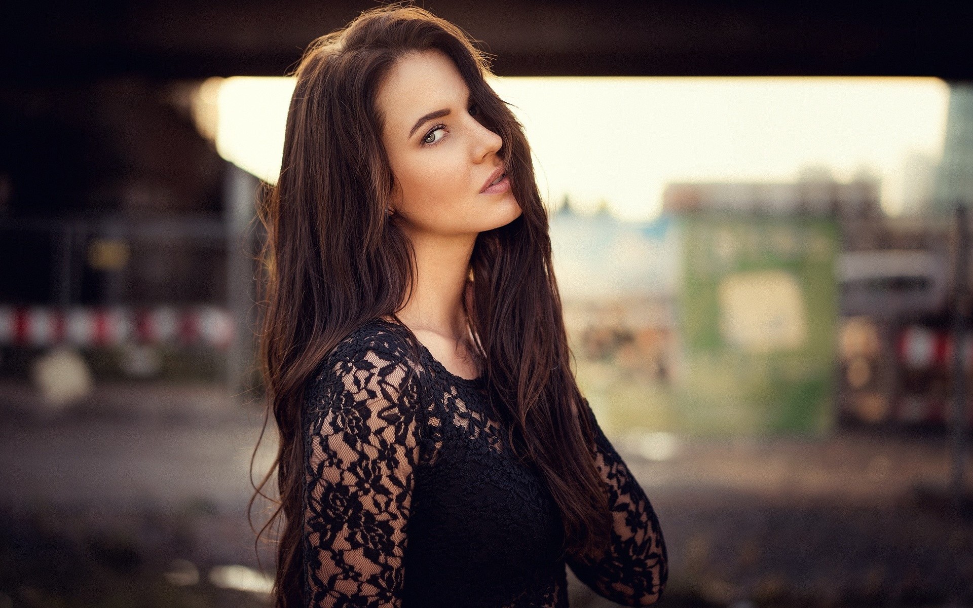Woman with long brown hair wearing a black lace top HD Wallpaper