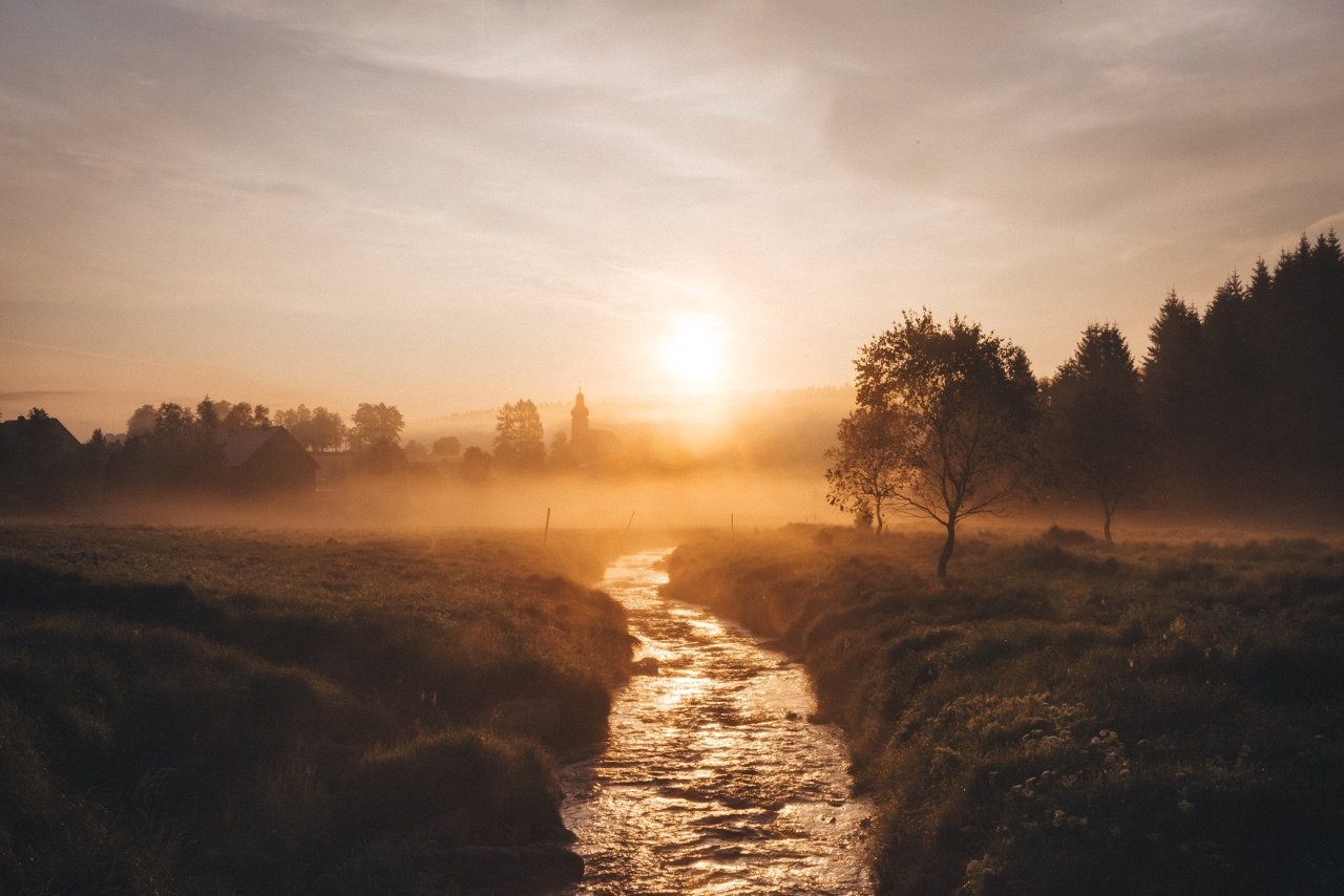 Misty sunrise over a stream in a rural landscape HD Wallpaper
