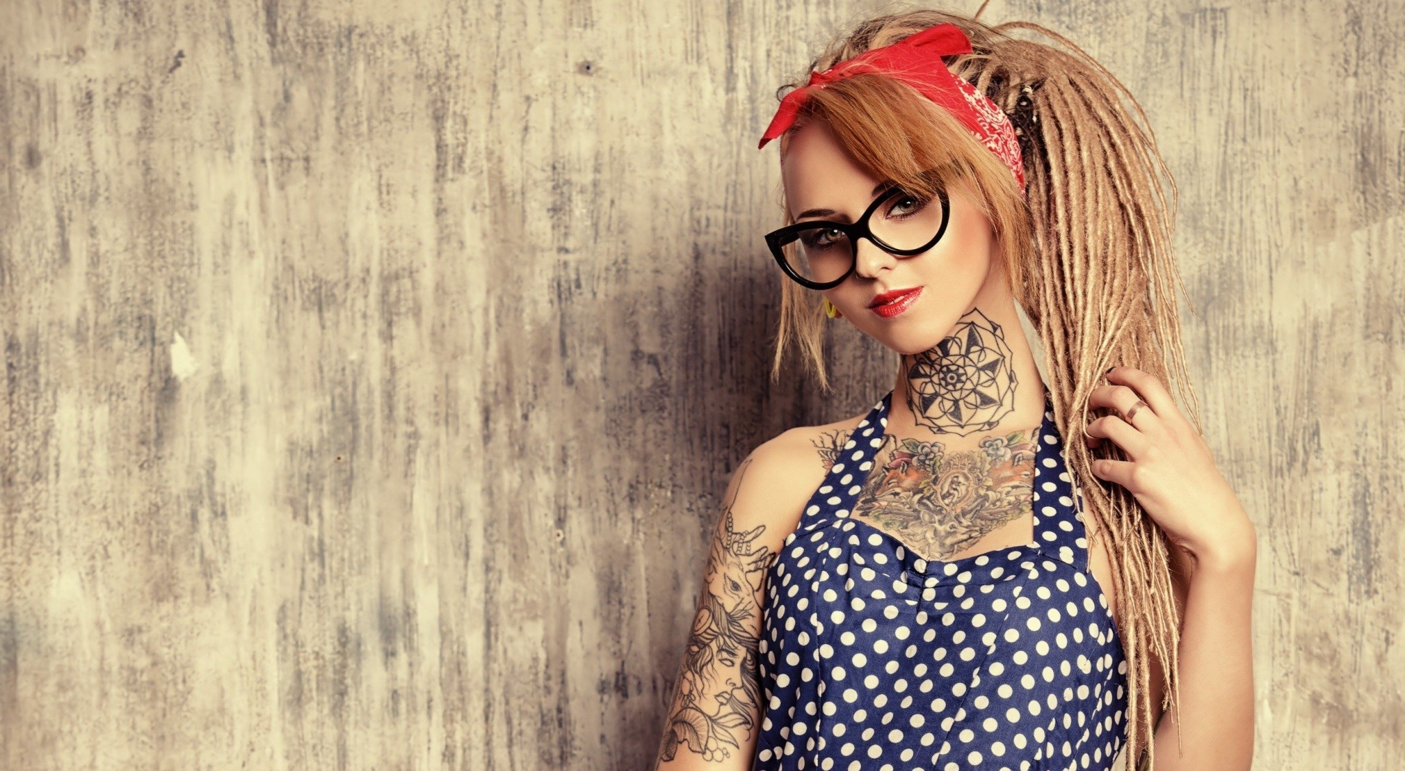 Woman with dreadlocks, glasses, and tattoos HD Wallpaper