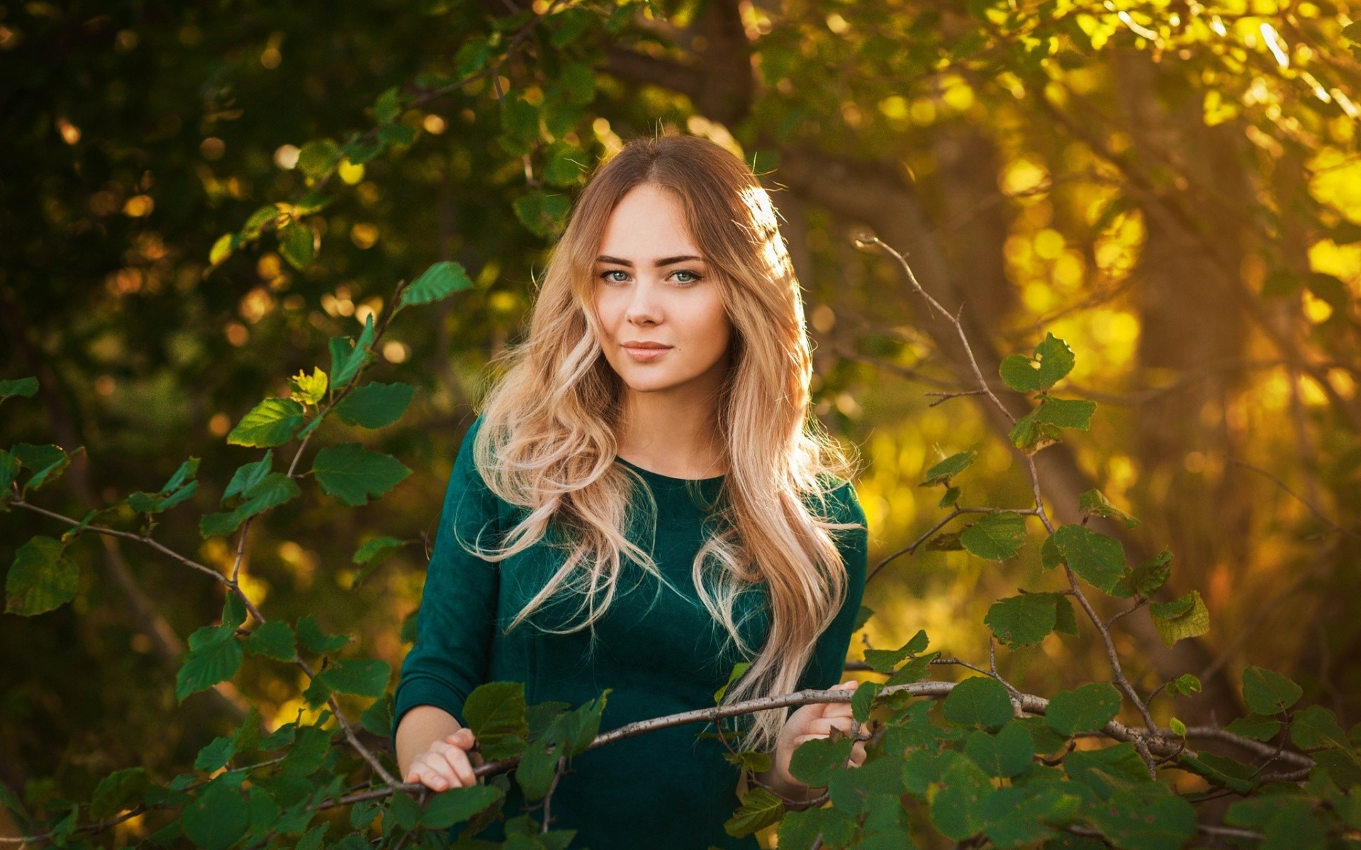 Woman with long blonde hair in a green dress outdoors HD Wallpaper