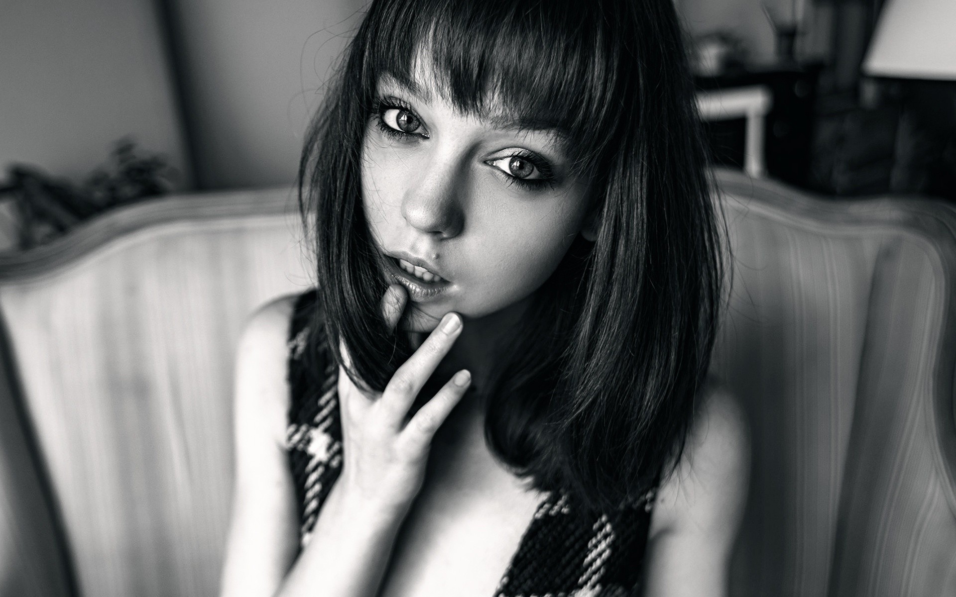 Monochrome portrait of a young woman with bangs HD Wallpaper