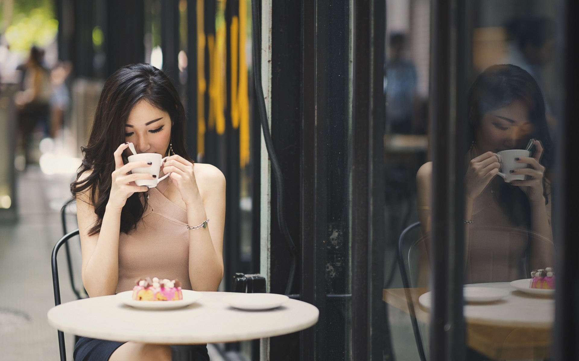 Asian woman drinking coffee at a cafe with cake HD Wallpaper