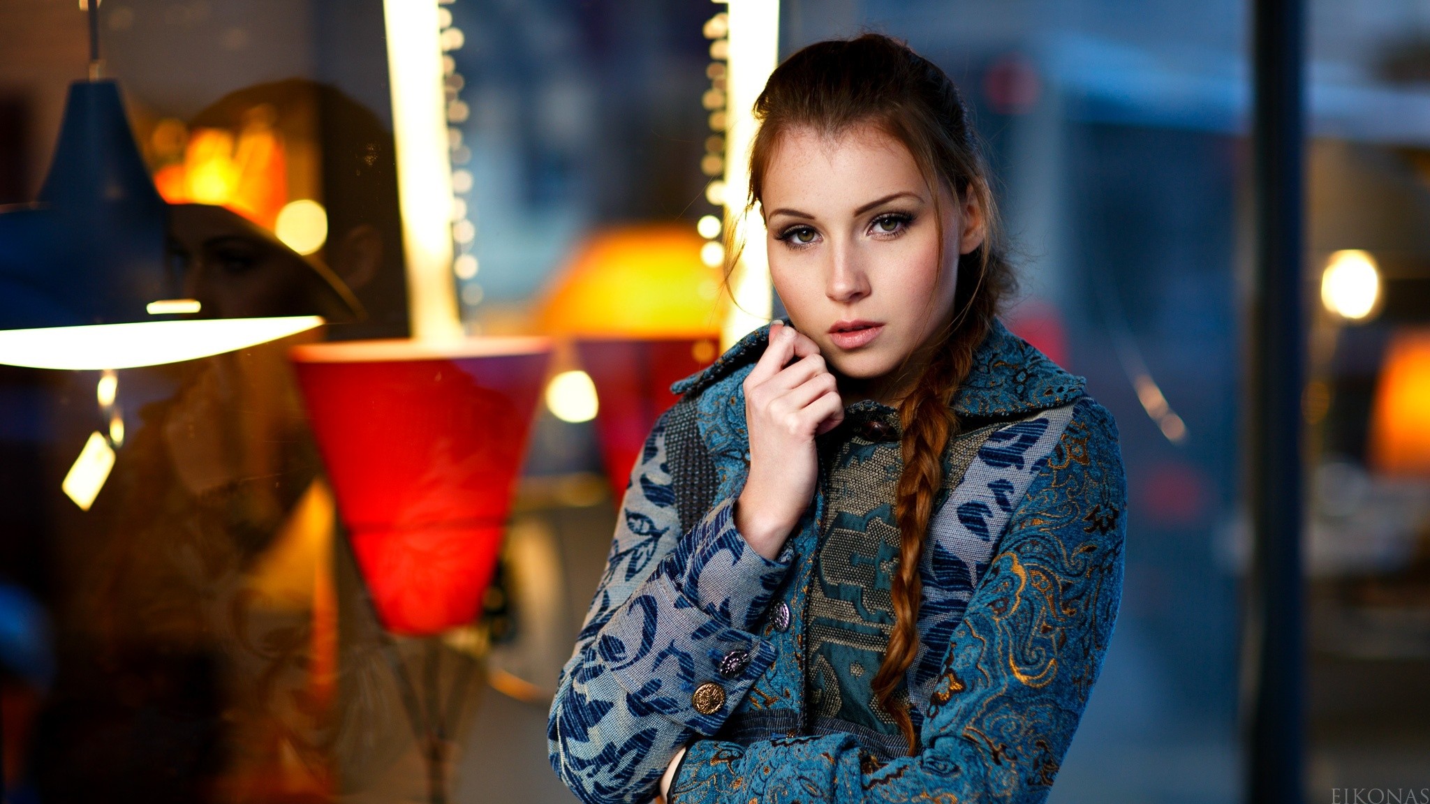 Woman with braid in patterned coat HD Wallpaper