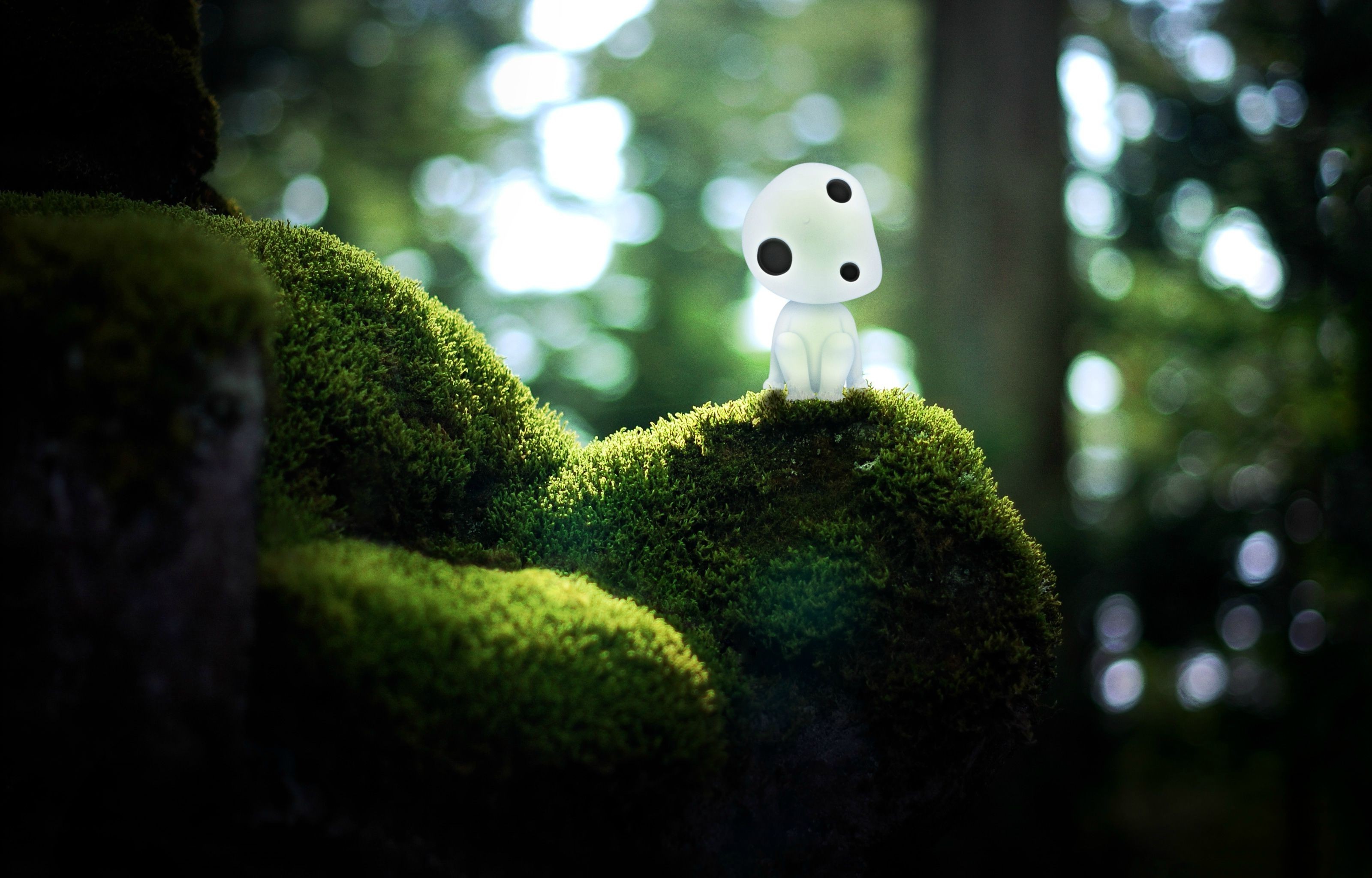 Kodama from Princess Mononoke on mossy rock HD Wallpaper