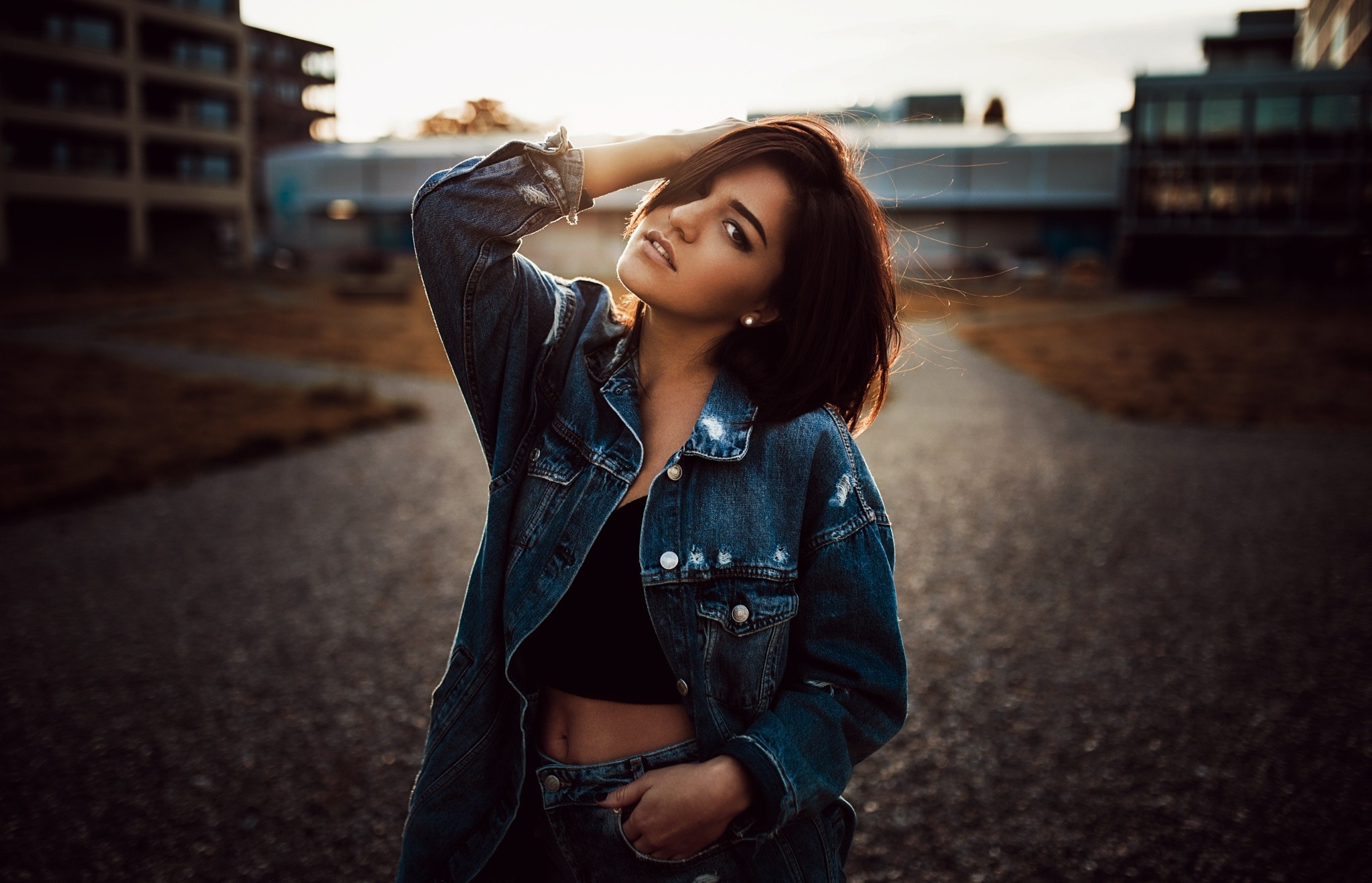 Woman in denim jacket at sunset HD Wallpaper