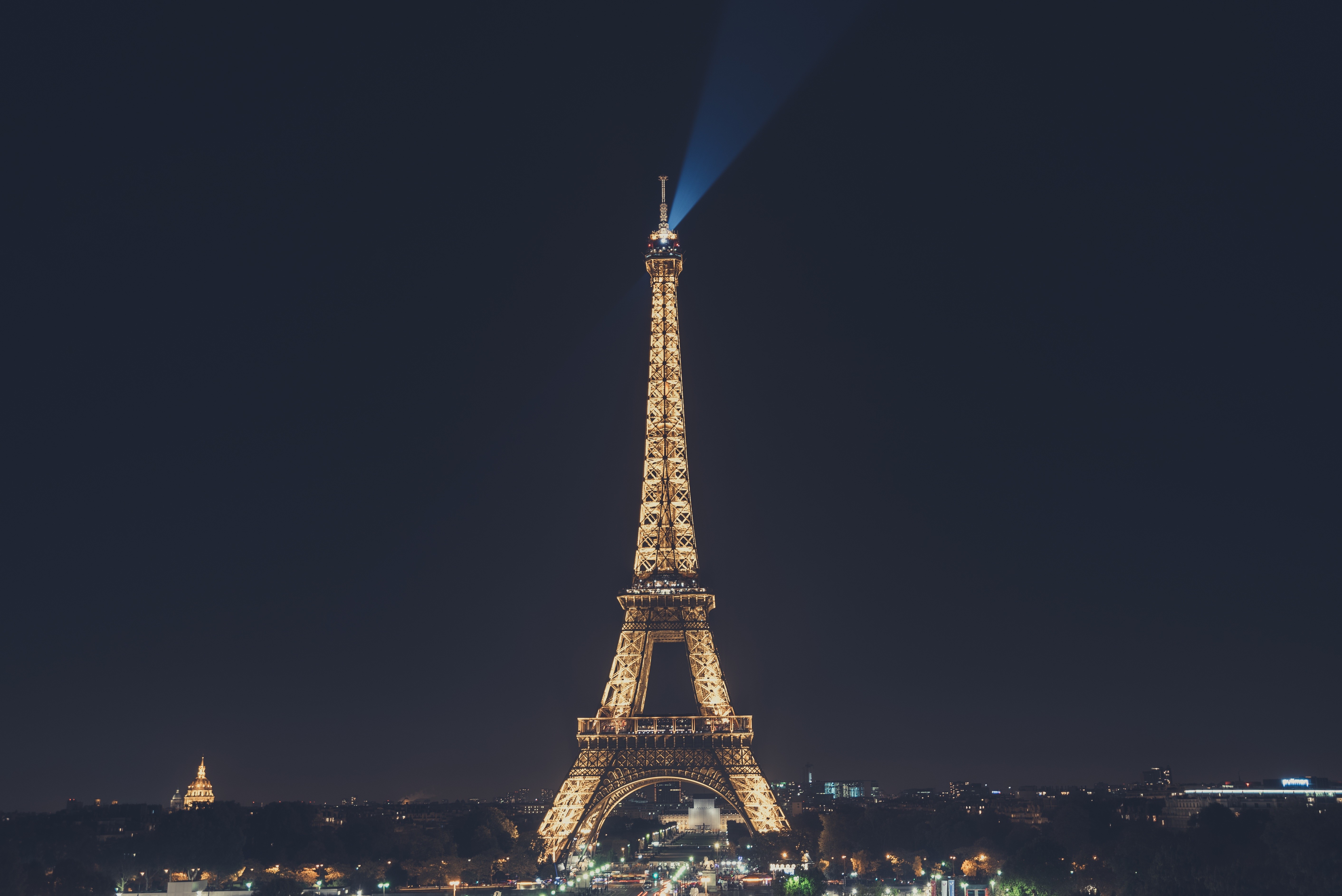 Eiffel Tower at night with a light beam HD Wallpaper