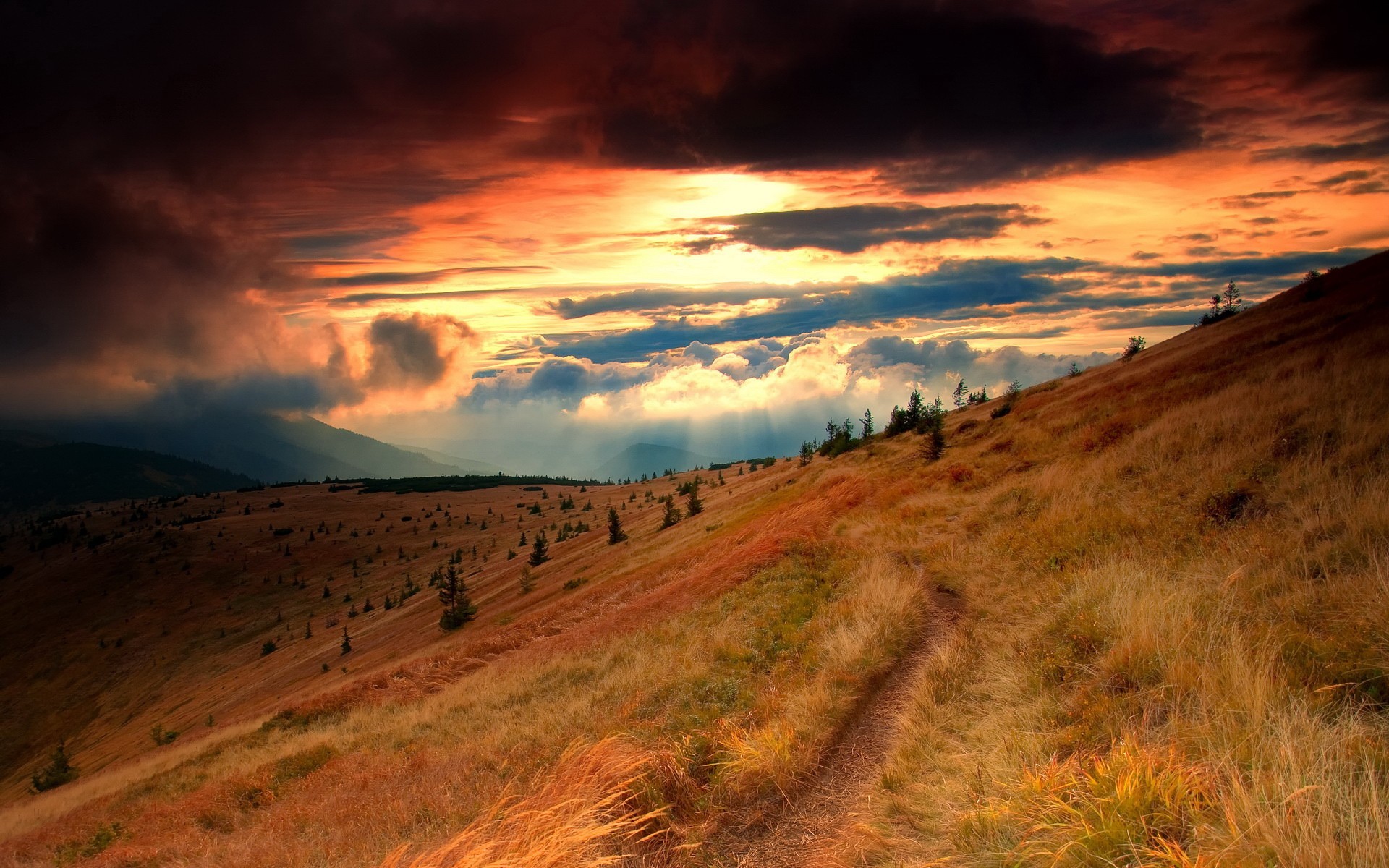 Mountain landscape at sunset with dramatic clouds HD Wallpaper
