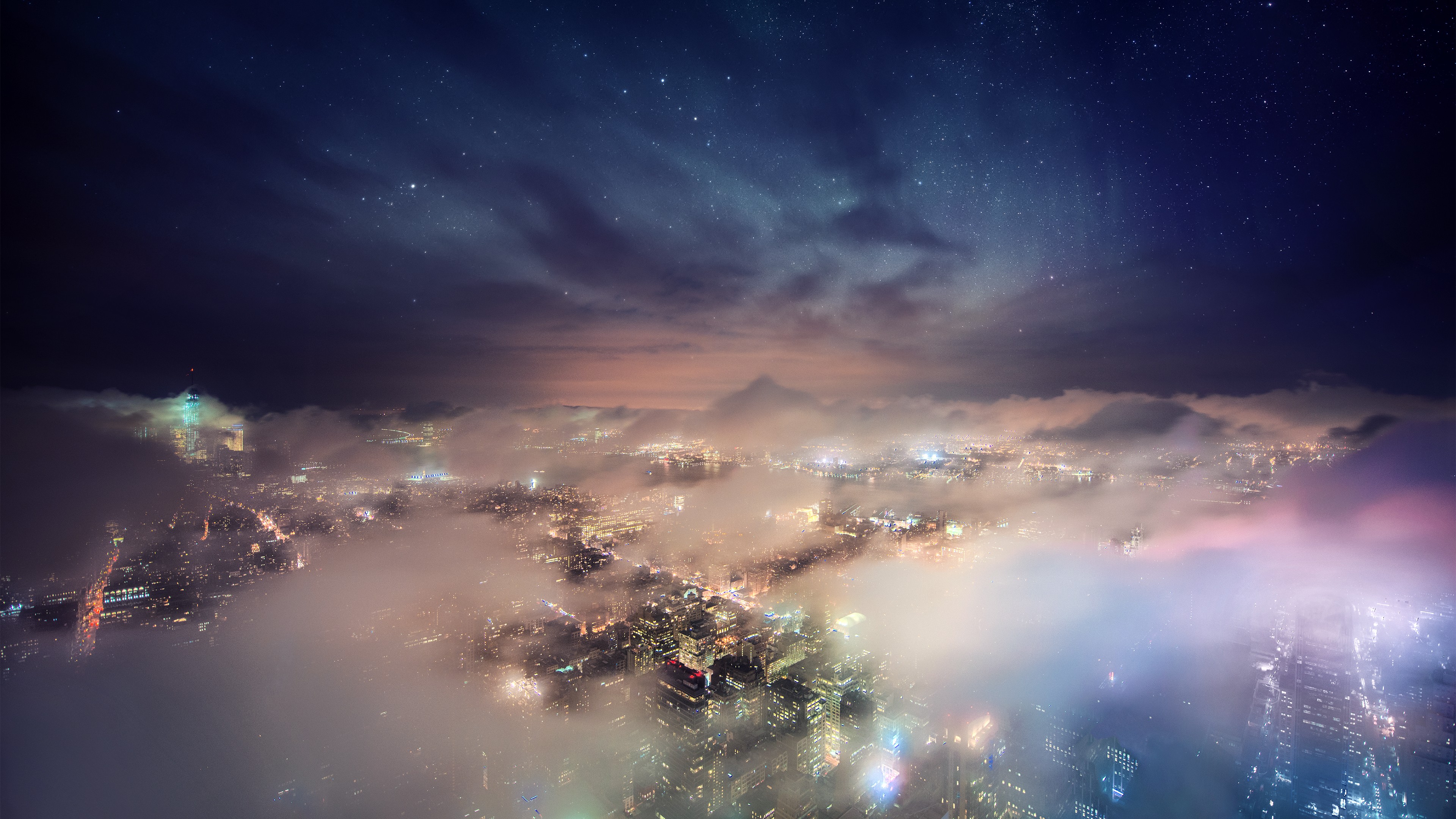 Cityscape at night with clouds and stars HD Wallpaper