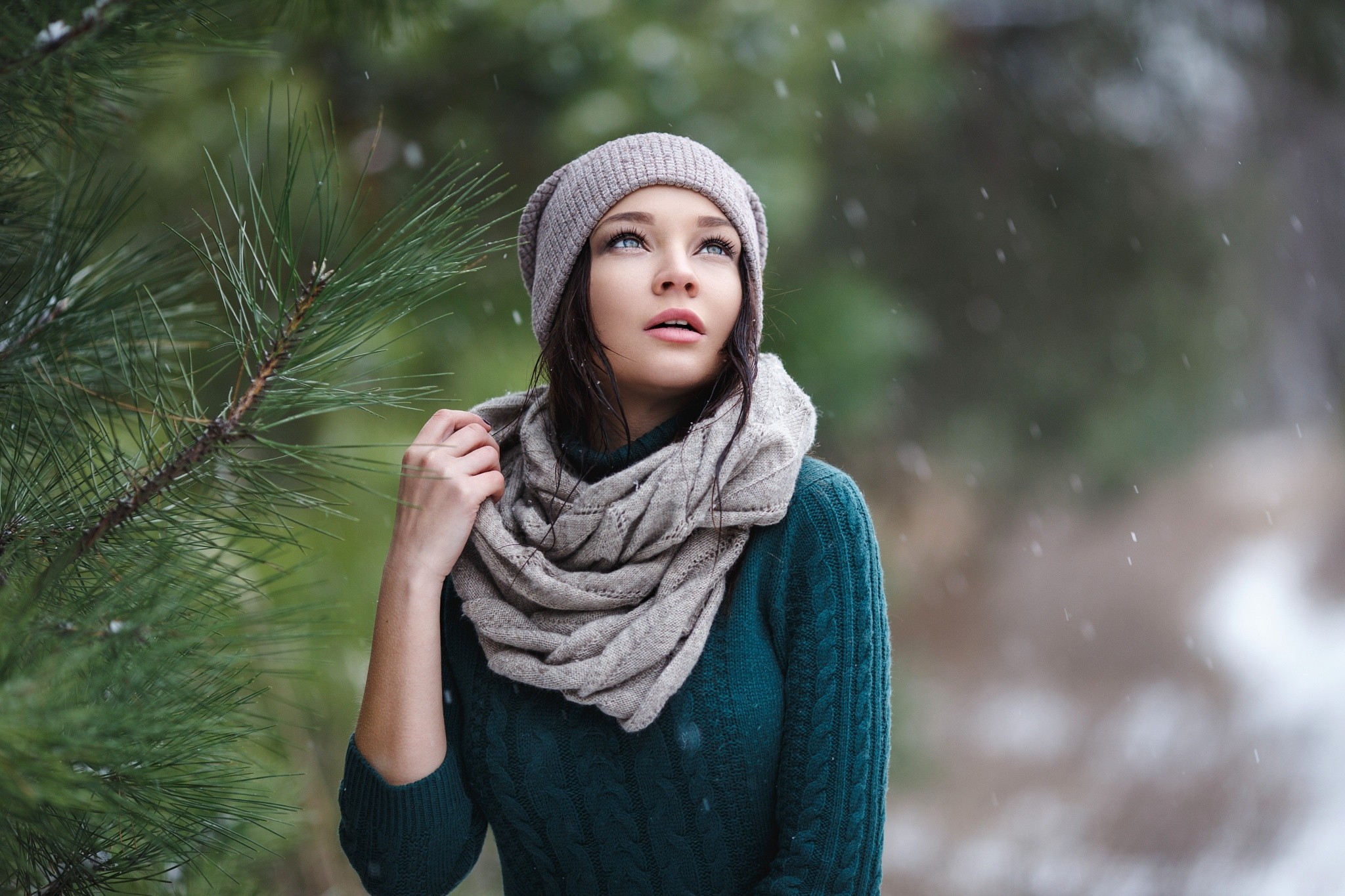 Portrait of a woman in a sweater and scarf outdoors in snow HD Wallpaper