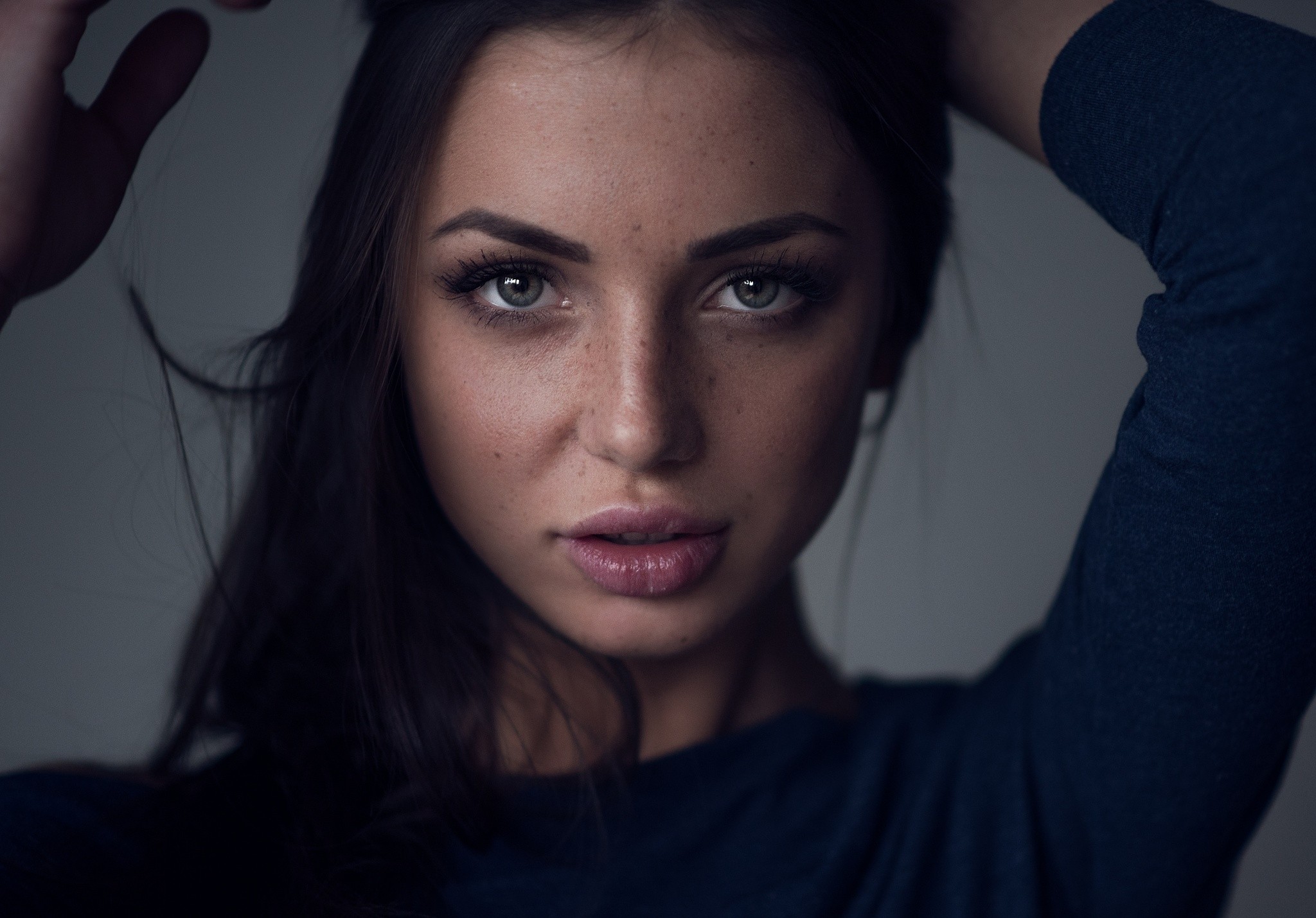 Woman with freckles and dark hair HD Wallpaper