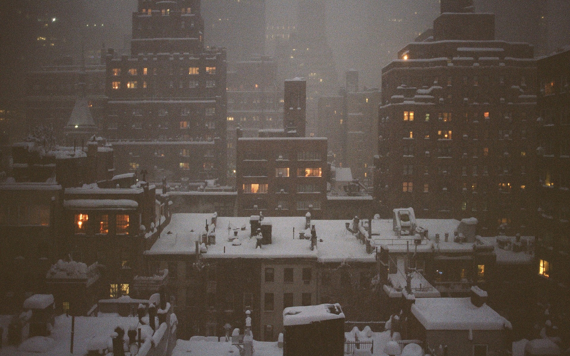 Cityscape at night during a snowstorm HD Wallpaper