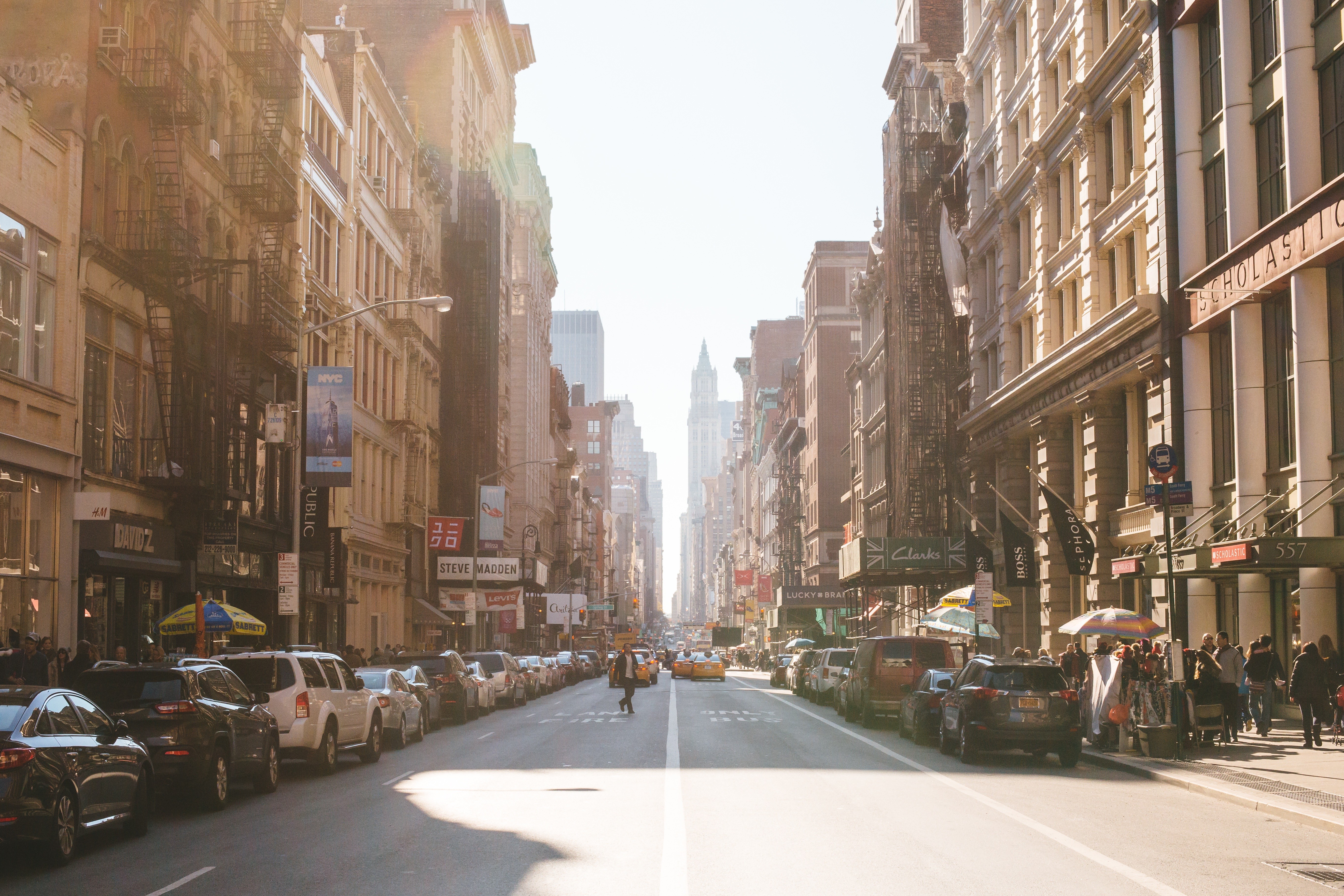 New York City street with buildings and cars HD Wallpaper