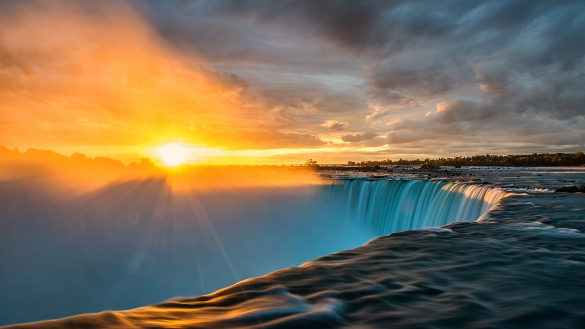 Niagara Falls at sunset with dramatic clouds HD Wallpaper