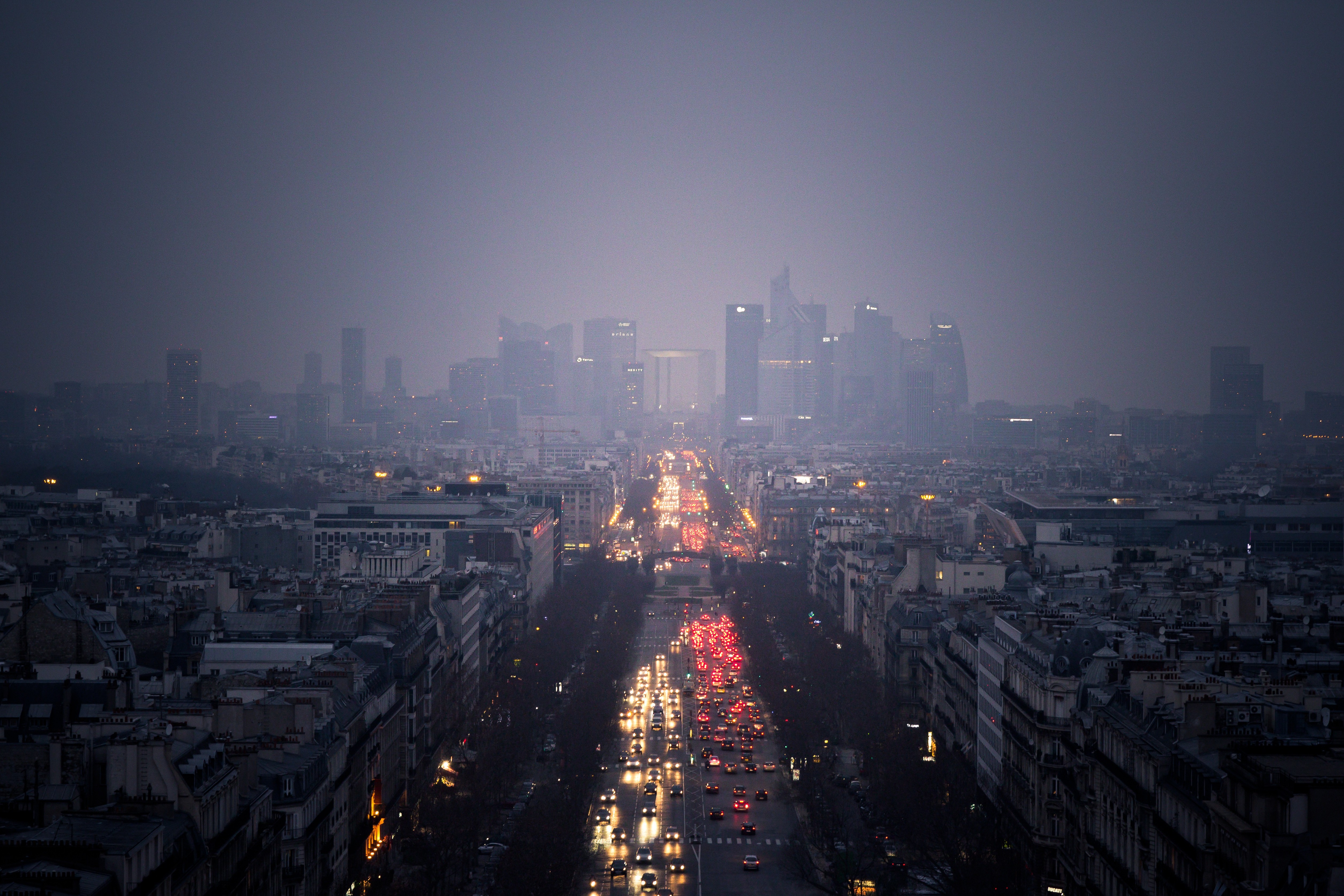 Paris cityscape in mist with traffic on Champs-Élysées HD Wallpaper