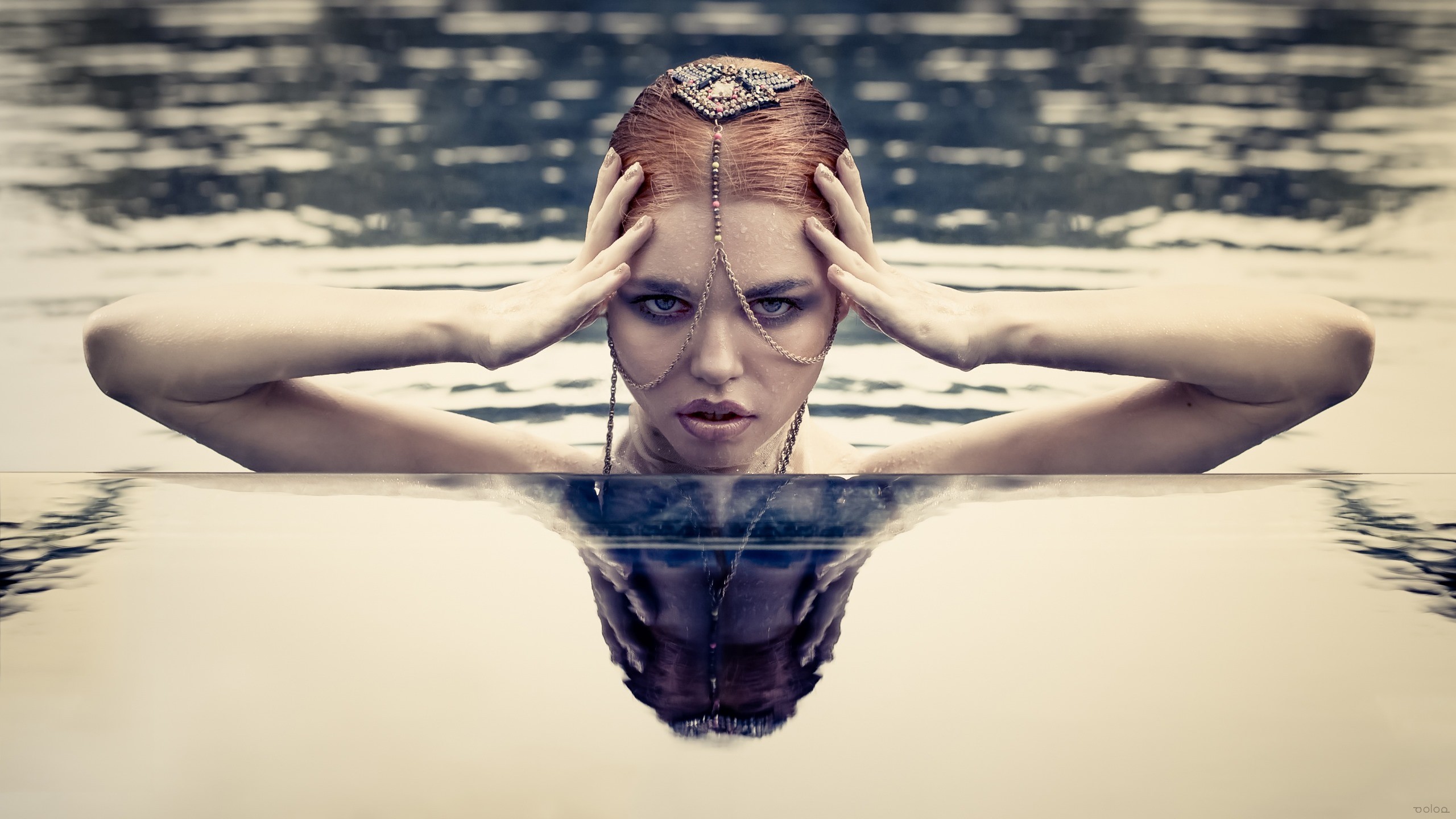 Woman with ornate headpiece in water HD Wallpaper
