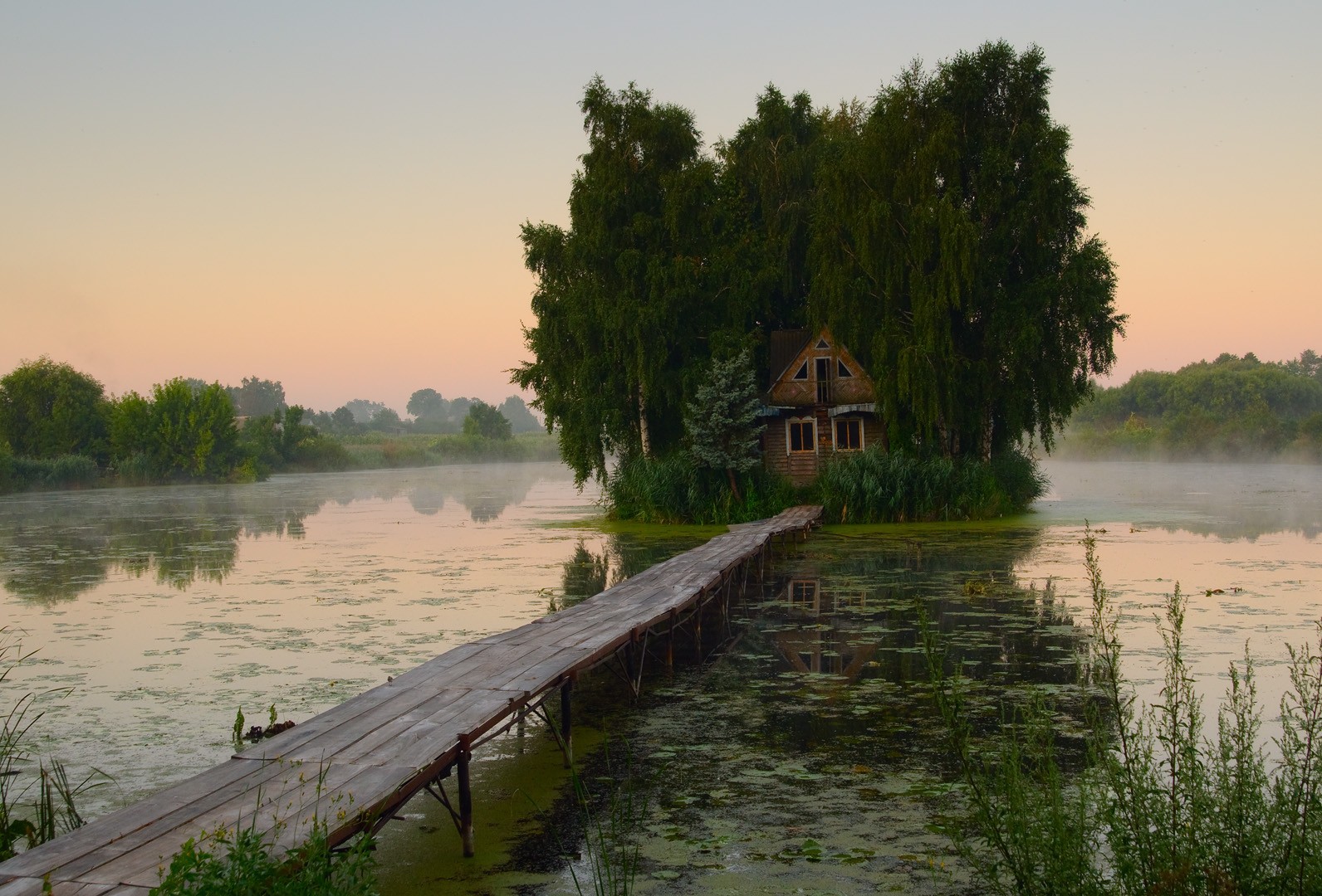 Wooden cabin on a small island with a bridge HD Wallpaper