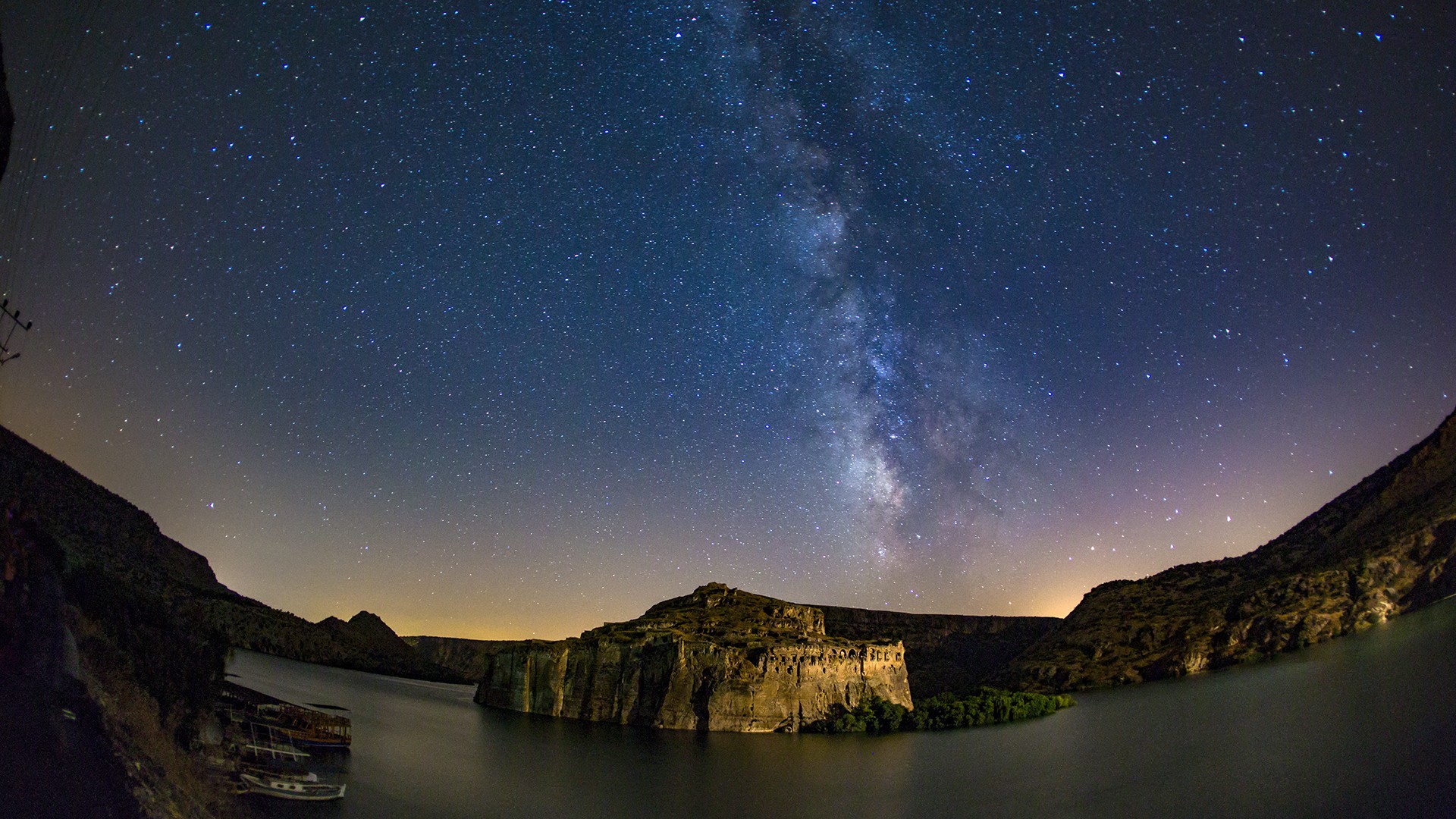 Milky Way over ancient ruins on a lake at night HD Wallpaper