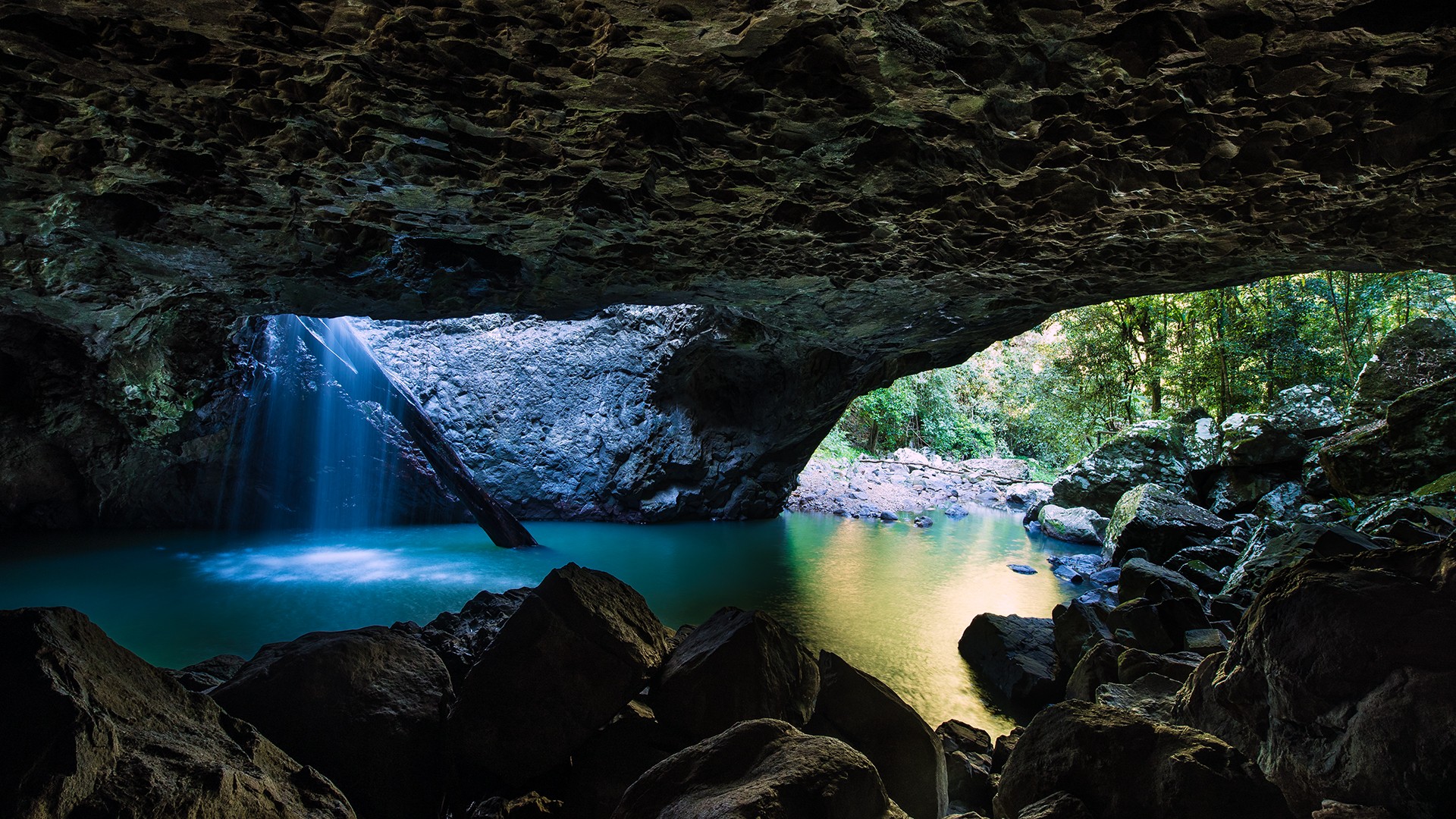 Cave with waterfall and turquoise water HD Wallpaper