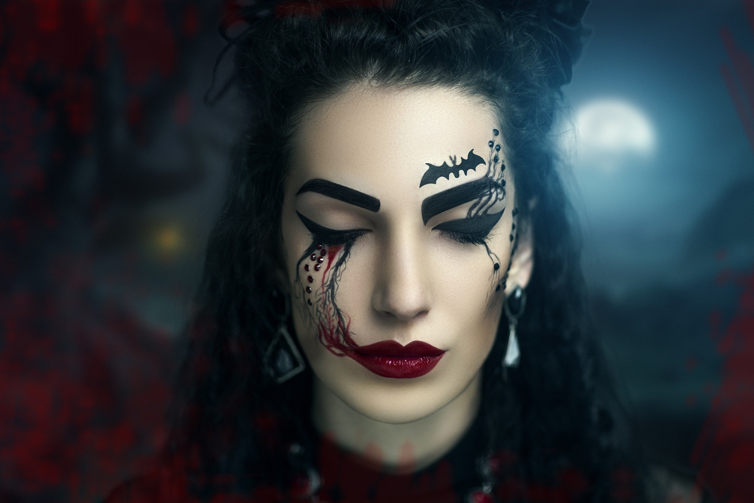 Woman with gothic makeup and bat design HD Wallpaper