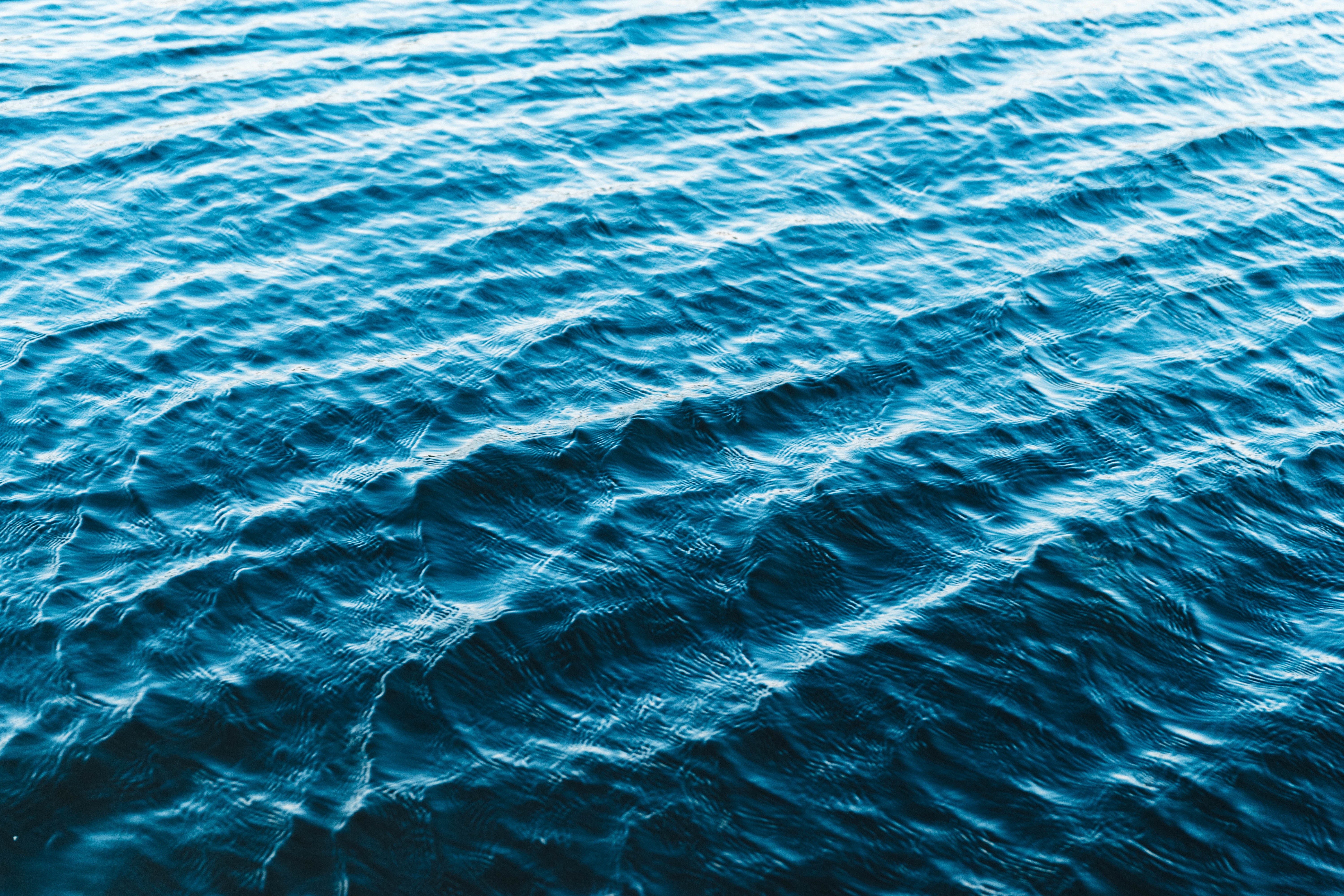 Blue water with ripples and waves HD Wallpaper