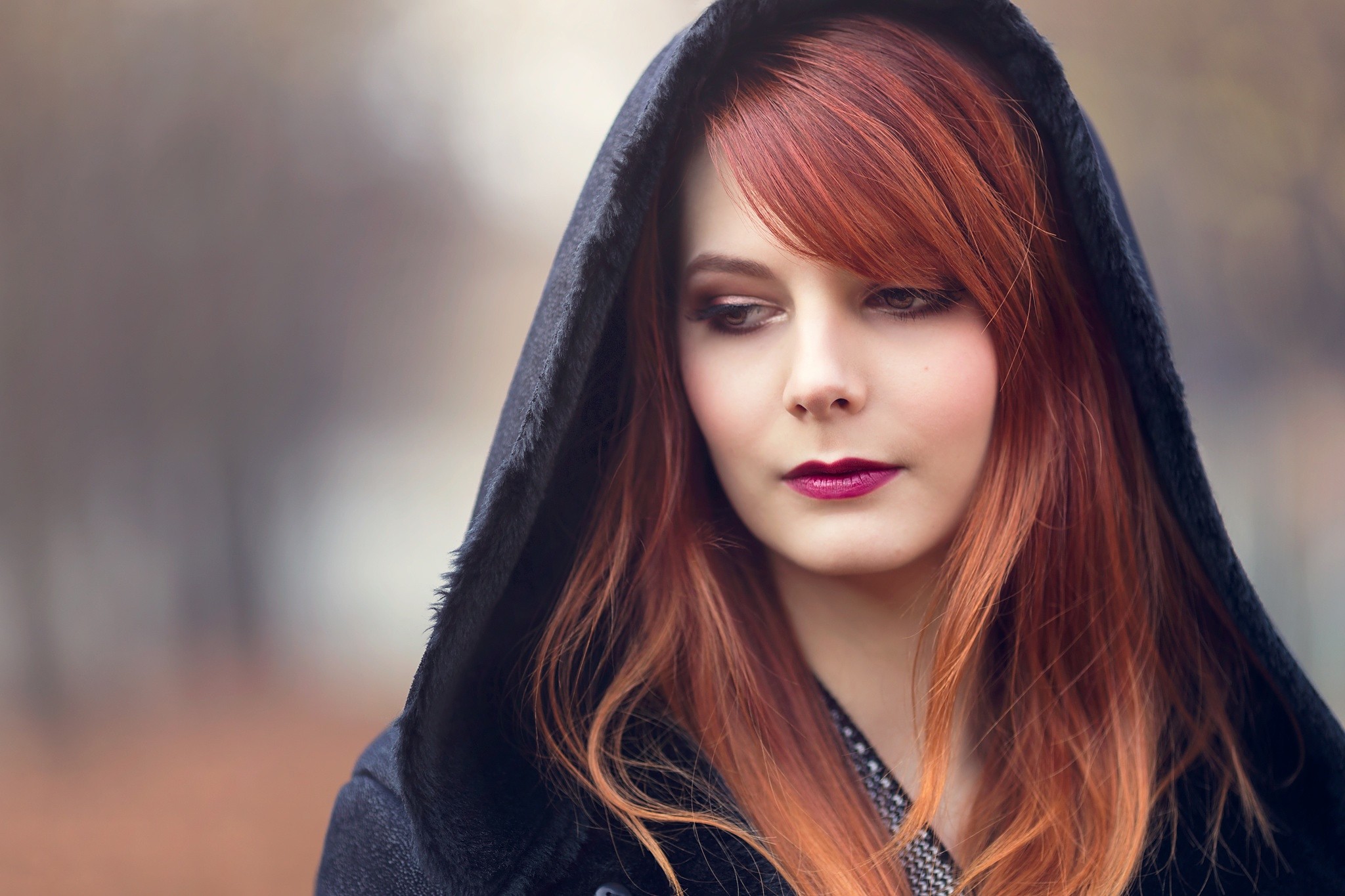 Redhead woman wearing a black hood outdoors HD Wallpaper