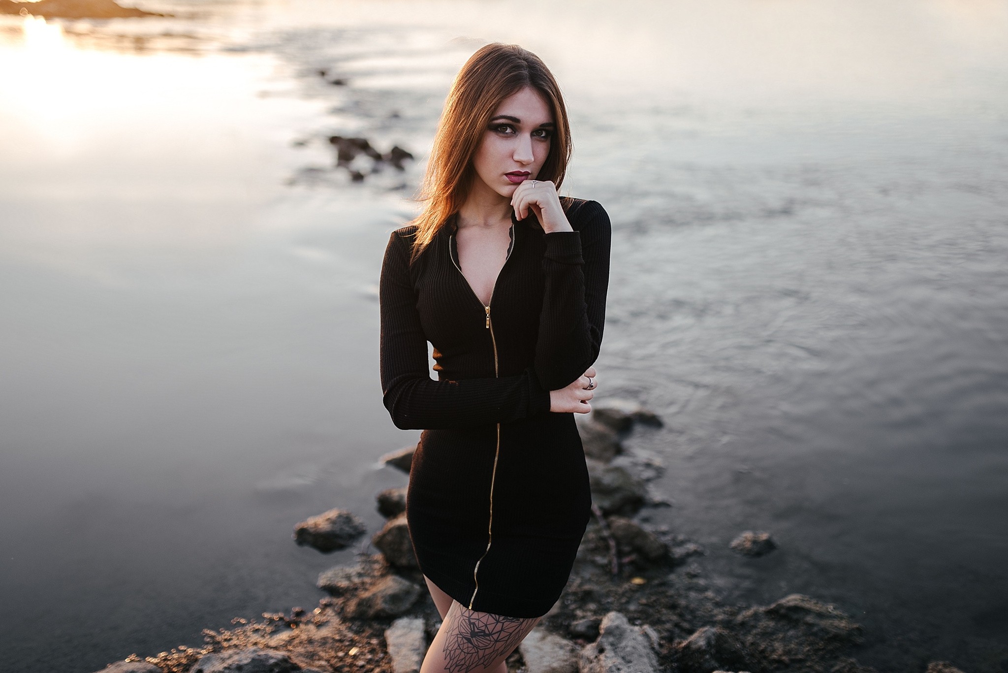 Woman in black dress posing by the water HD Wallpaper