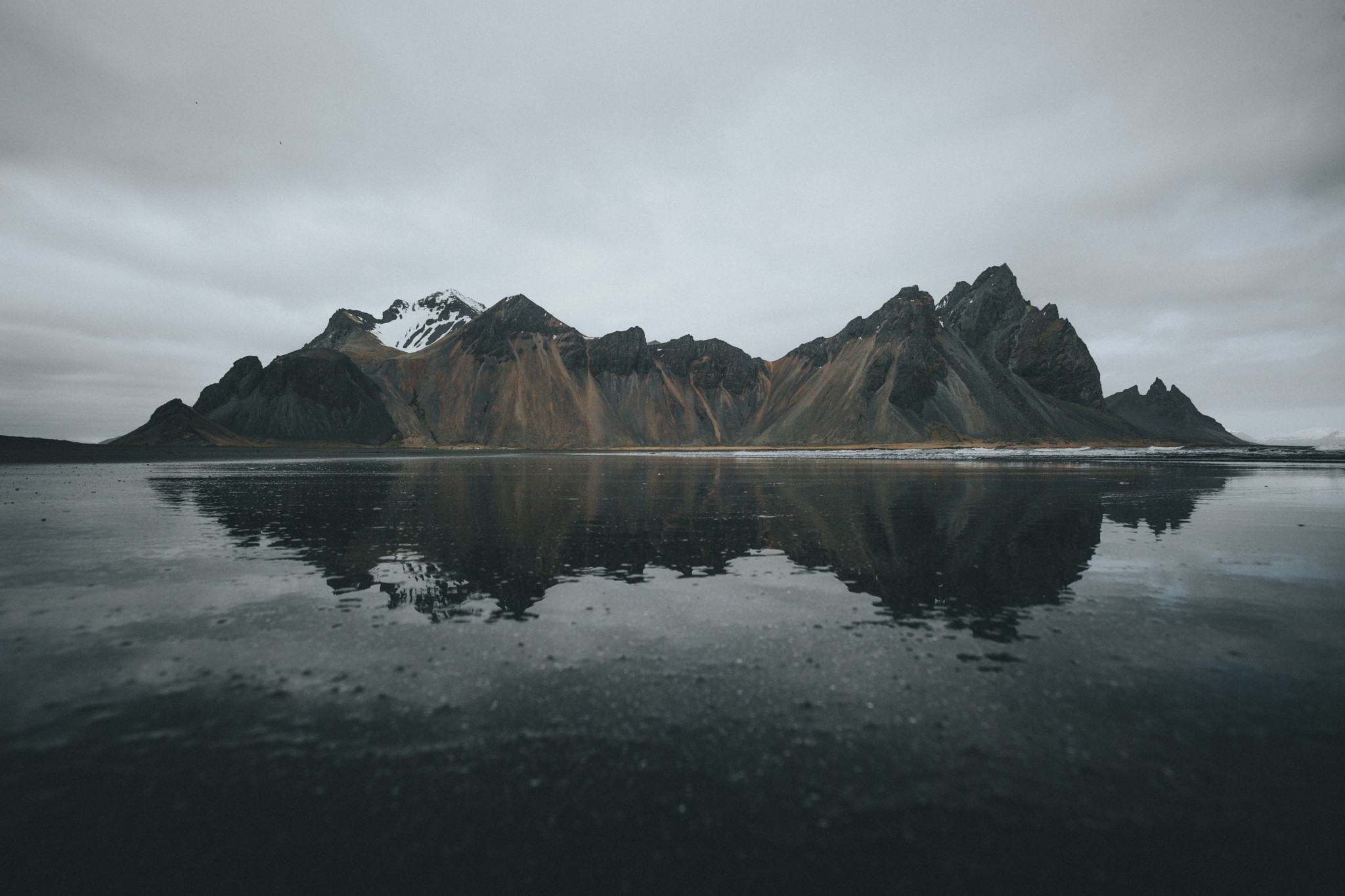 Snow-capped mountains reflected in water HD Wallpaper