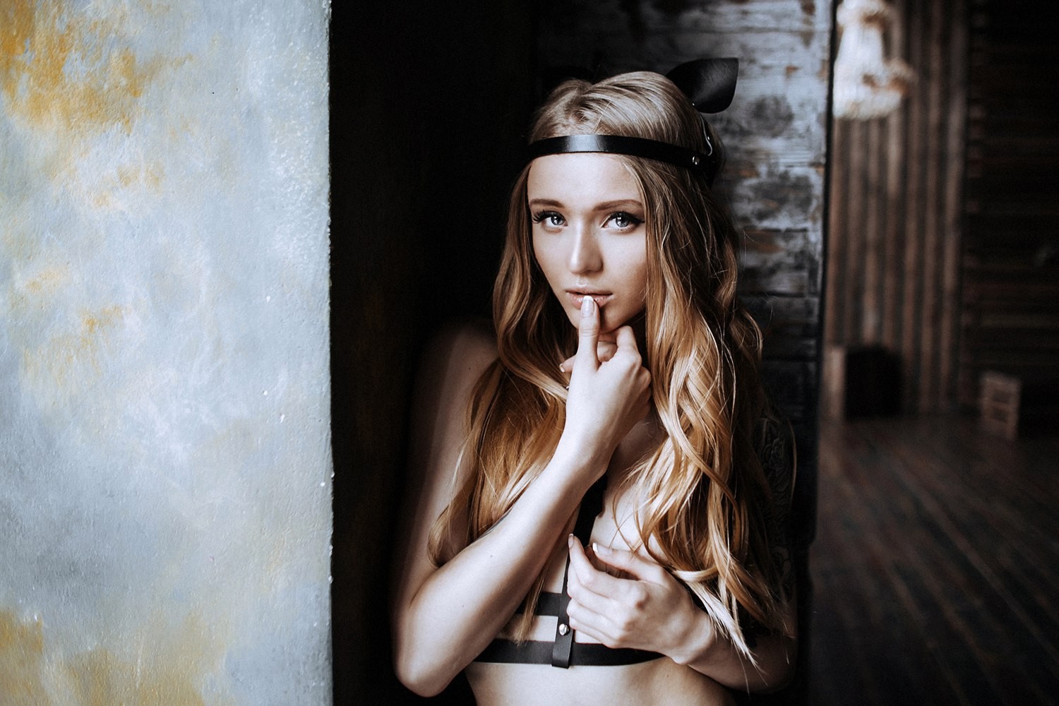 Woman with cat ears headband and finger on lips HD Wallpaper