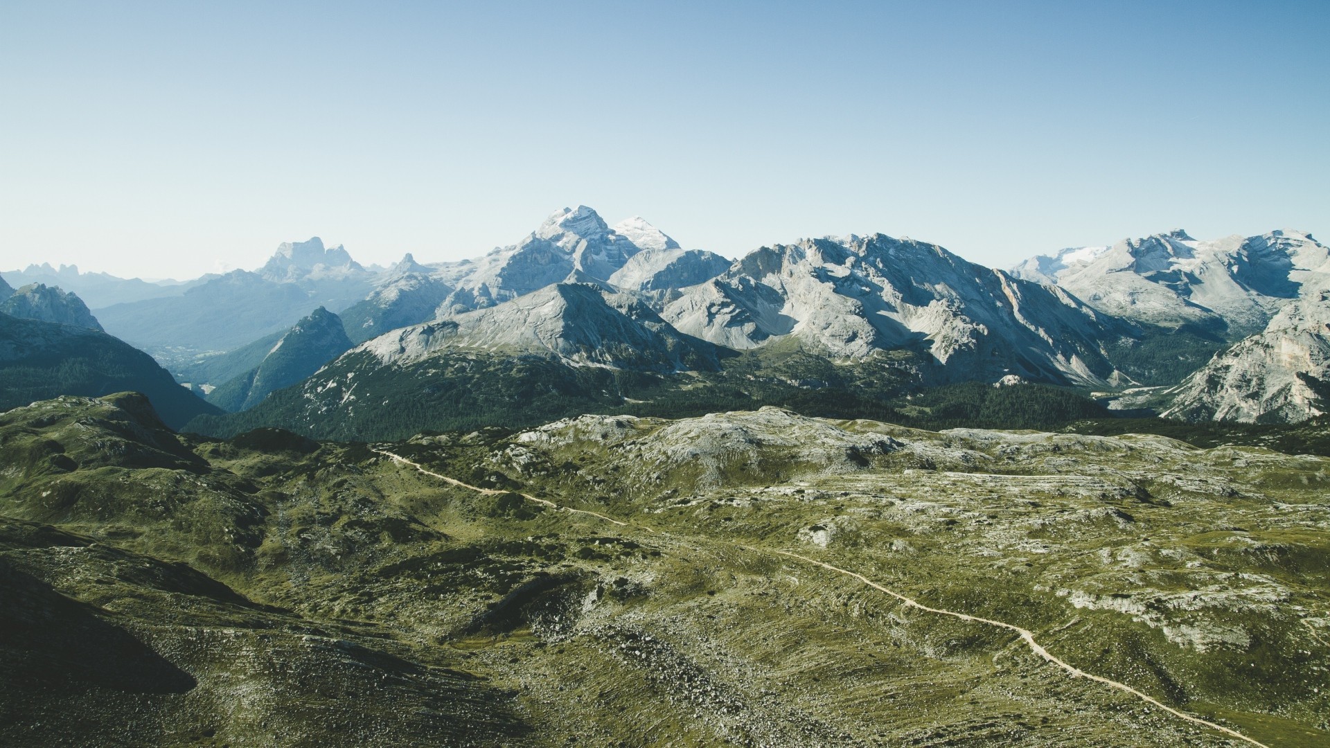 Mountain range with a winding path HD Wallpaper