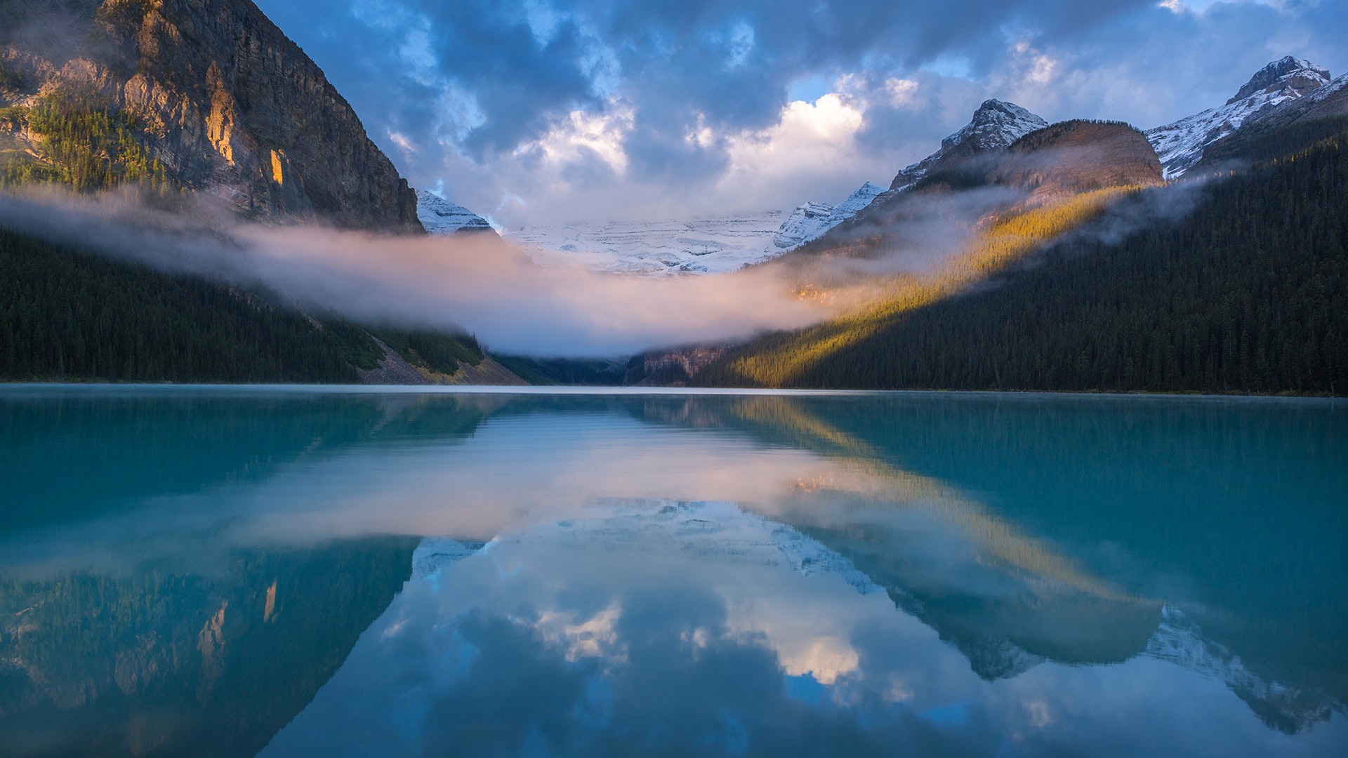 Lake Louise with mountains and mist HD Wallpaper
