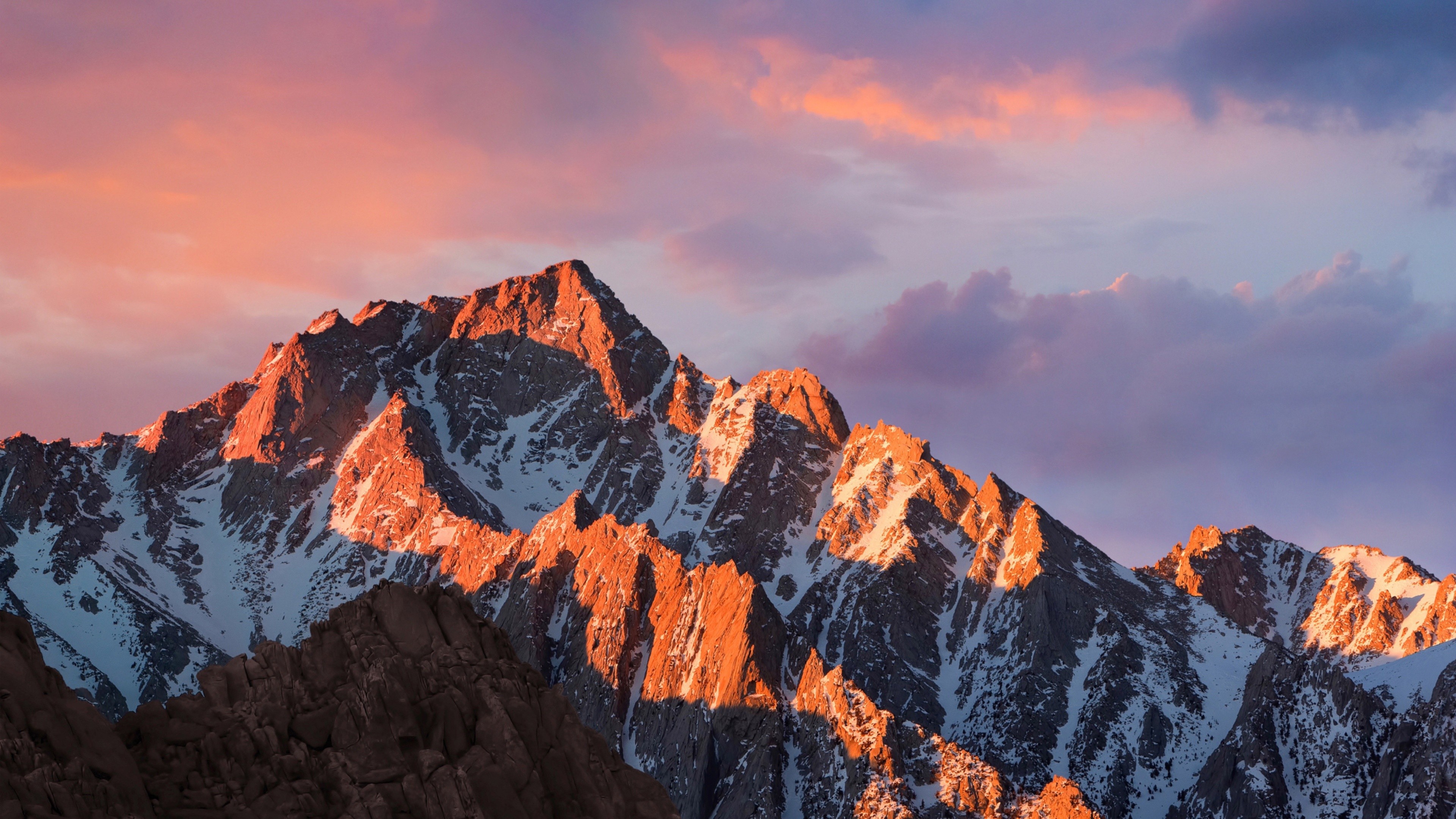 Snow-capped mountains at sunset with colorful clouds HD Wallpaper