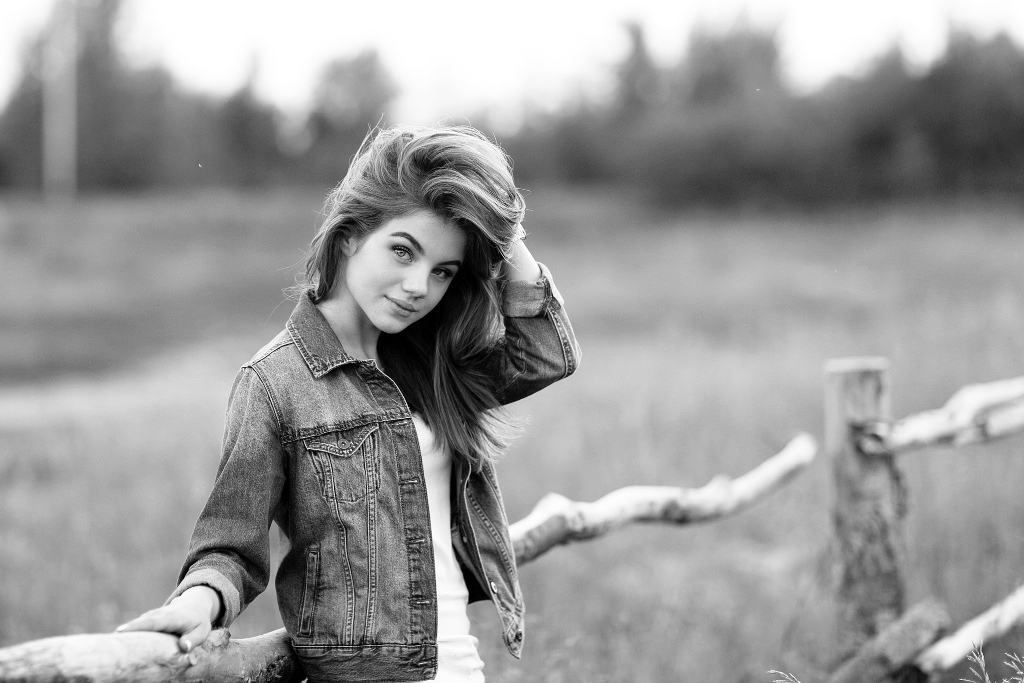 Young woman in denim jacket outdoors HD Wallpaper