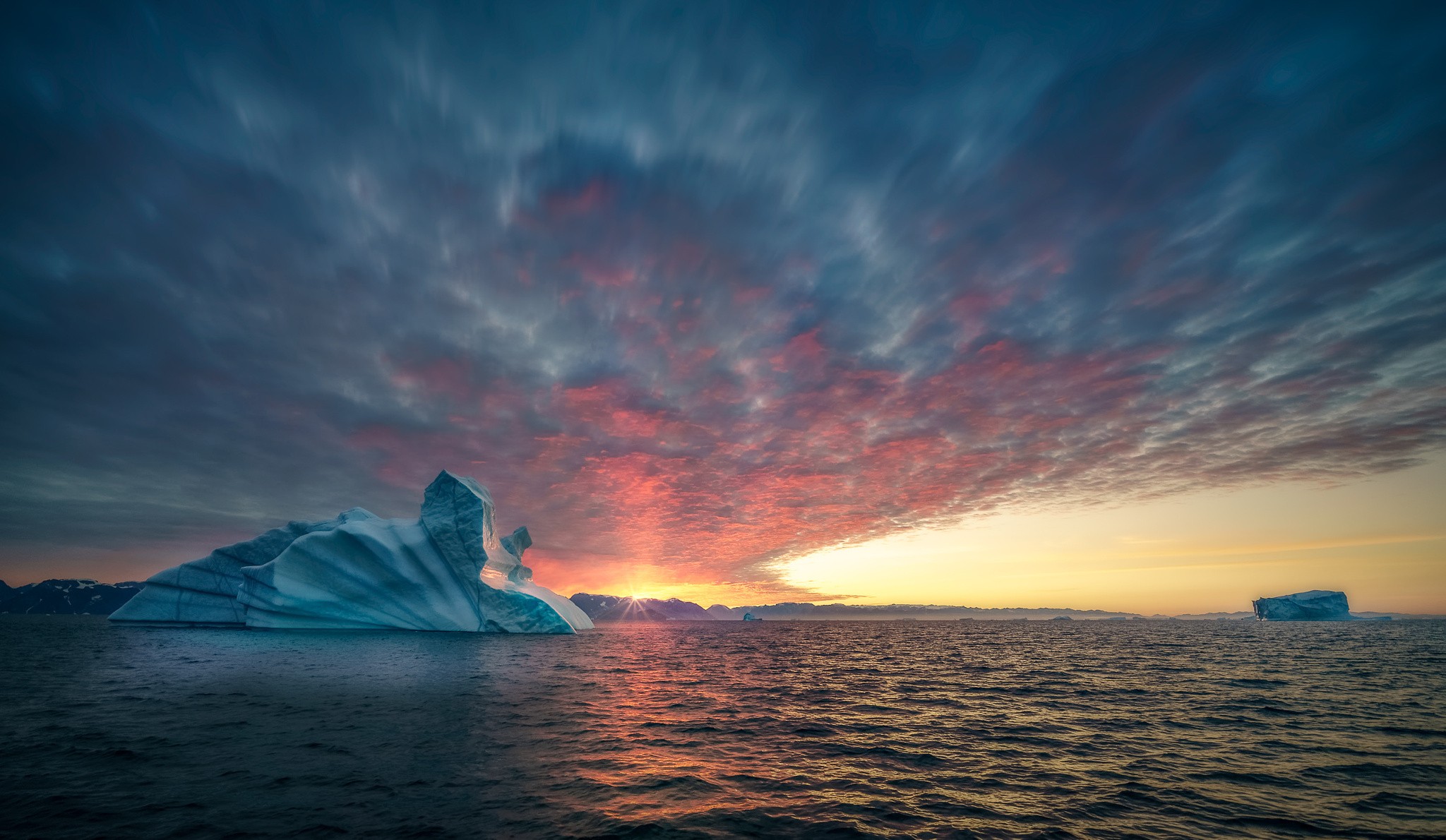 Iceberg in the ocean during sunset HD Wallpaper