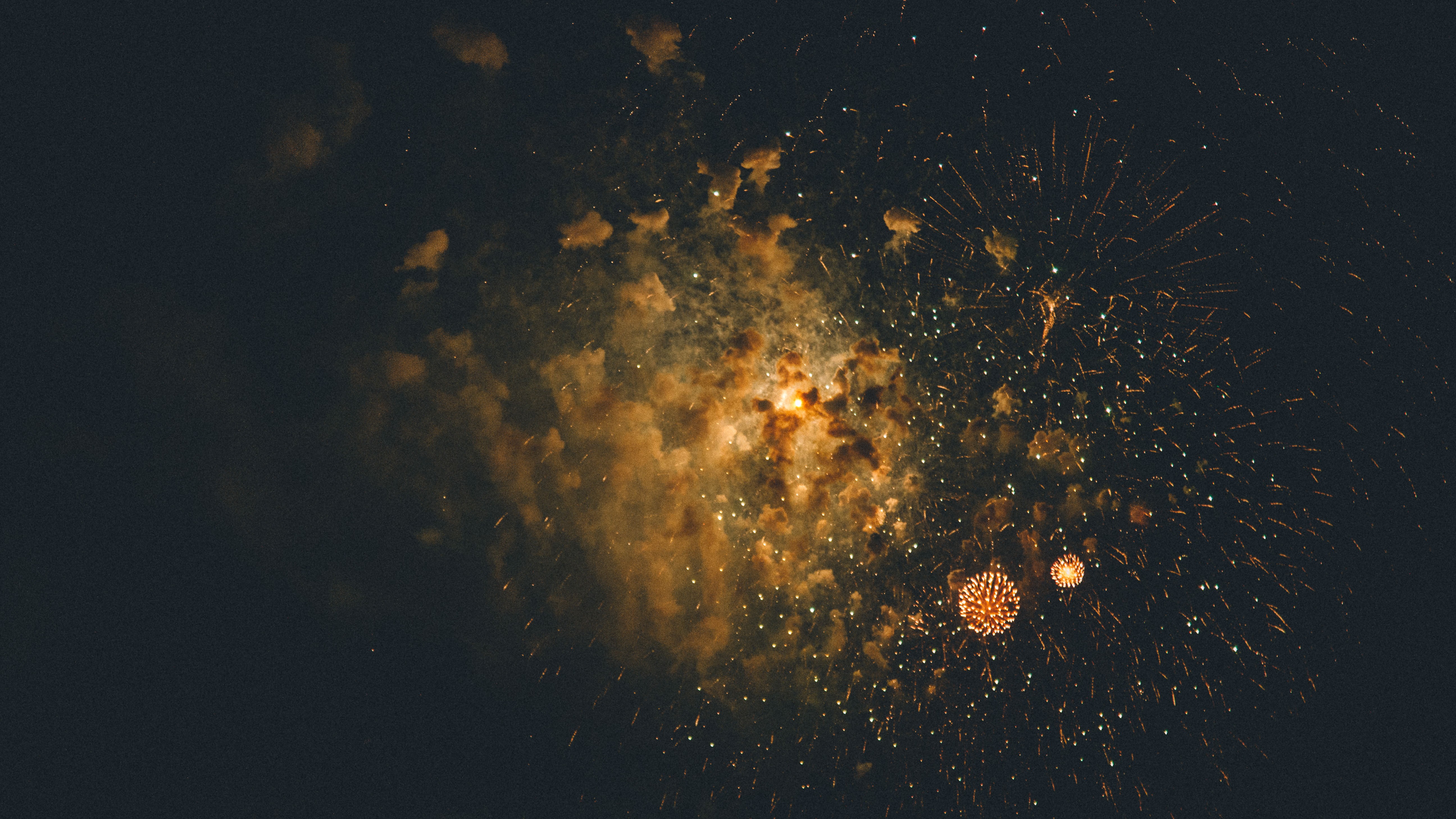 Fireworks exploding in the night sky HD Wallpaper
